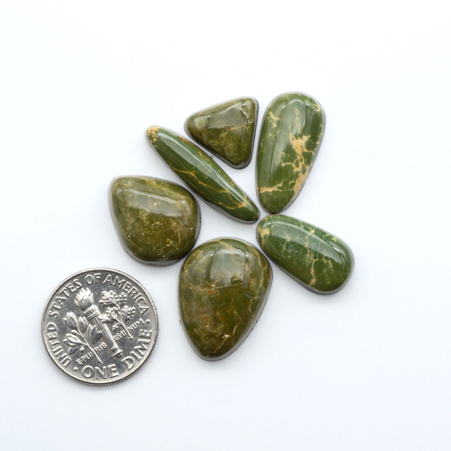 Hand-cut Natural Cerrillos Turquoise cabochons with rare blue-green hues and historic New Mexico origins—perfect for artisan jewelry.