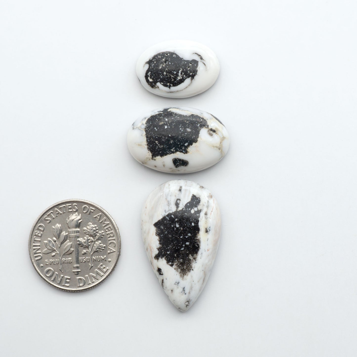 Natural White Buffalo Stone Cabochons are semi-precious gemstones cut into shapes ideal for jewelry-making, making them an excellent choice for artisans.
