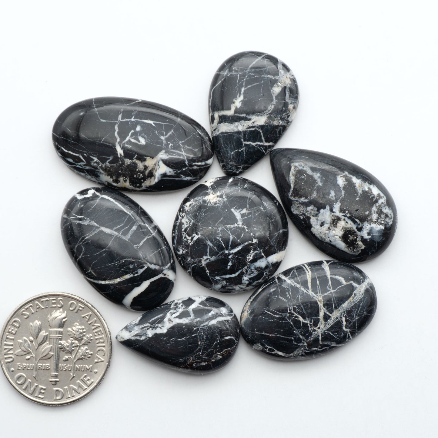 Natural White Buffalo Stone Cabochons are semi-precious gemstones cut into shapes ideal for jewelry-making, making them an excellent choice for artisans.