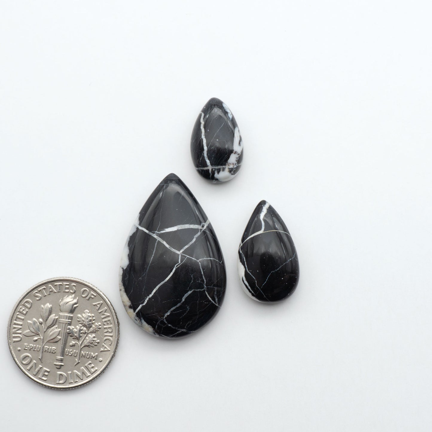 Natural White Buffalo Stone Cabochons are semi-precious gemstones cut into shapes ideal for jewelry-making, making them an excellent choice for artisans.