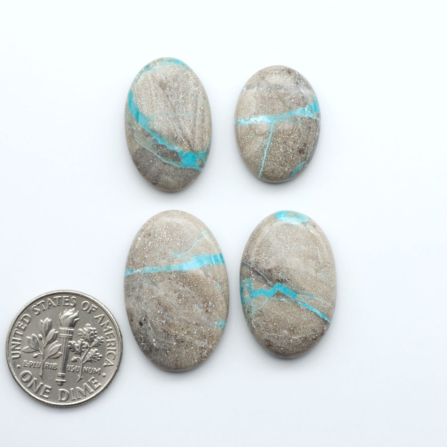 Carico Lake Turquoise cabochons with vibrant aqua-blue to turquoise tones and natural matrix, ideal for rings, pendants, and artisan jewelry.