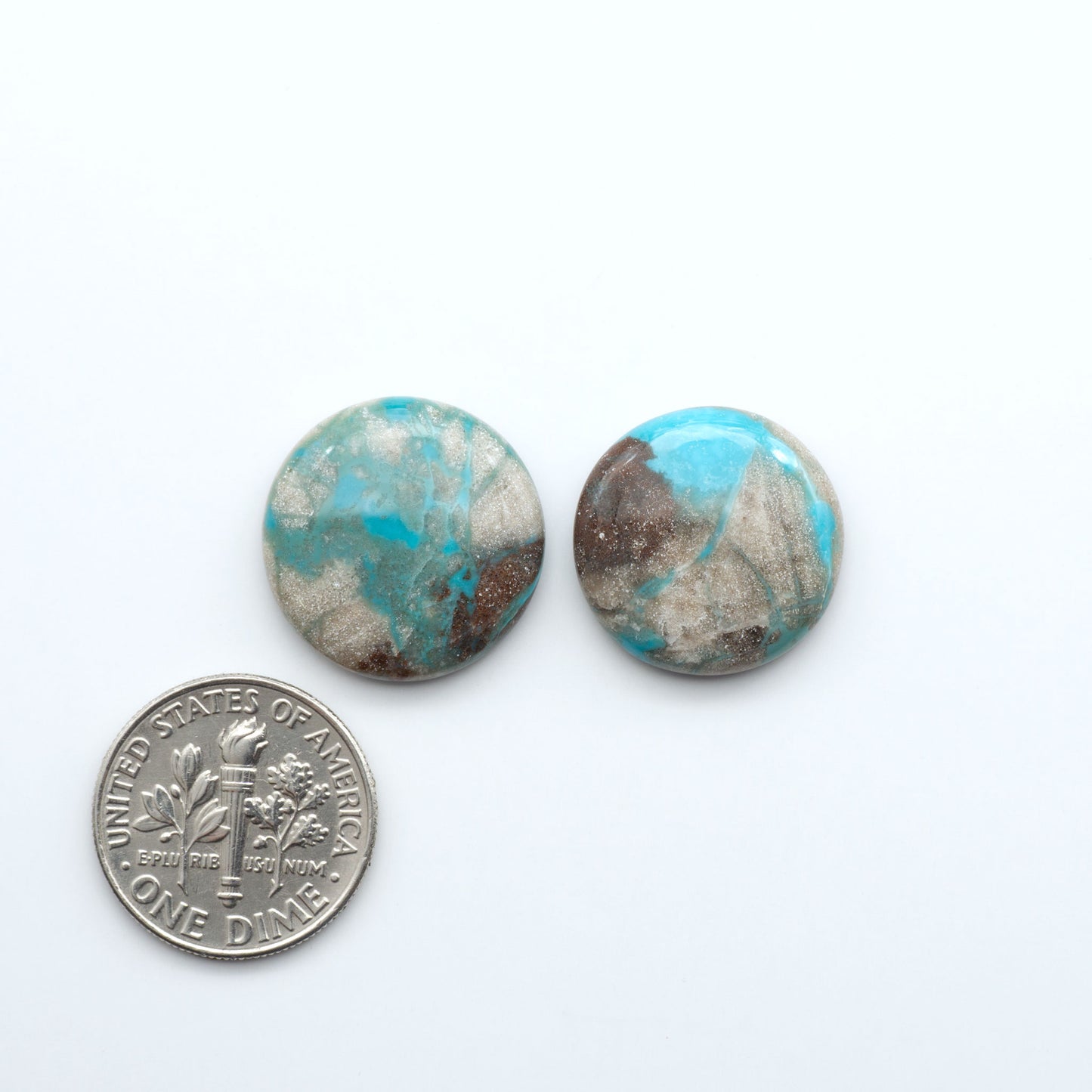Carico Lake Turquoise cabochons with vibrant aqua-blue to turquoise tones and natural matrix, ideal for rings, pendants, and artisan jewelry.