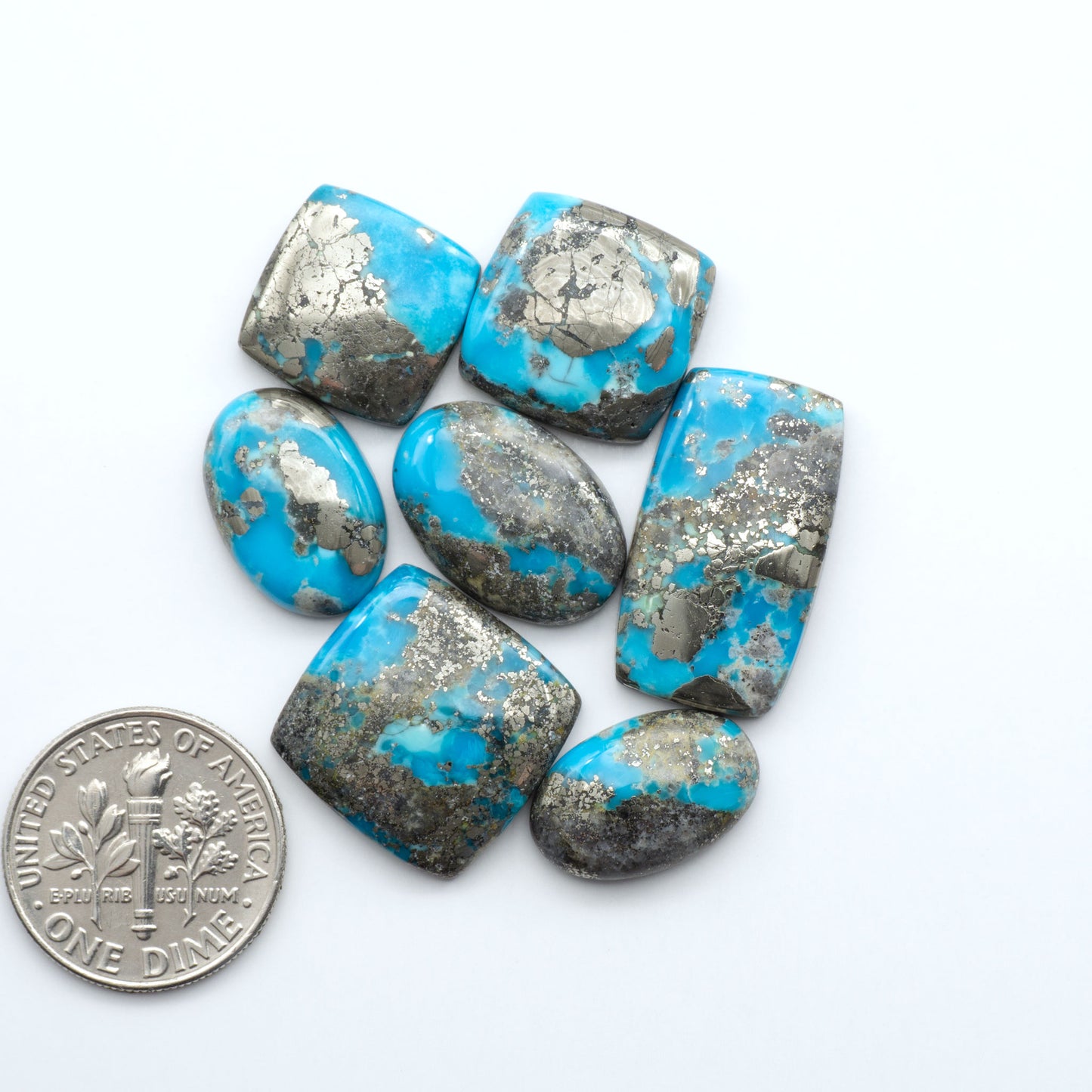 Nacozari turquoise cabochons are striking gemstones known for their vibrant blue to greenish-blue colors and pyrite, these stones are prized in jewelry making.