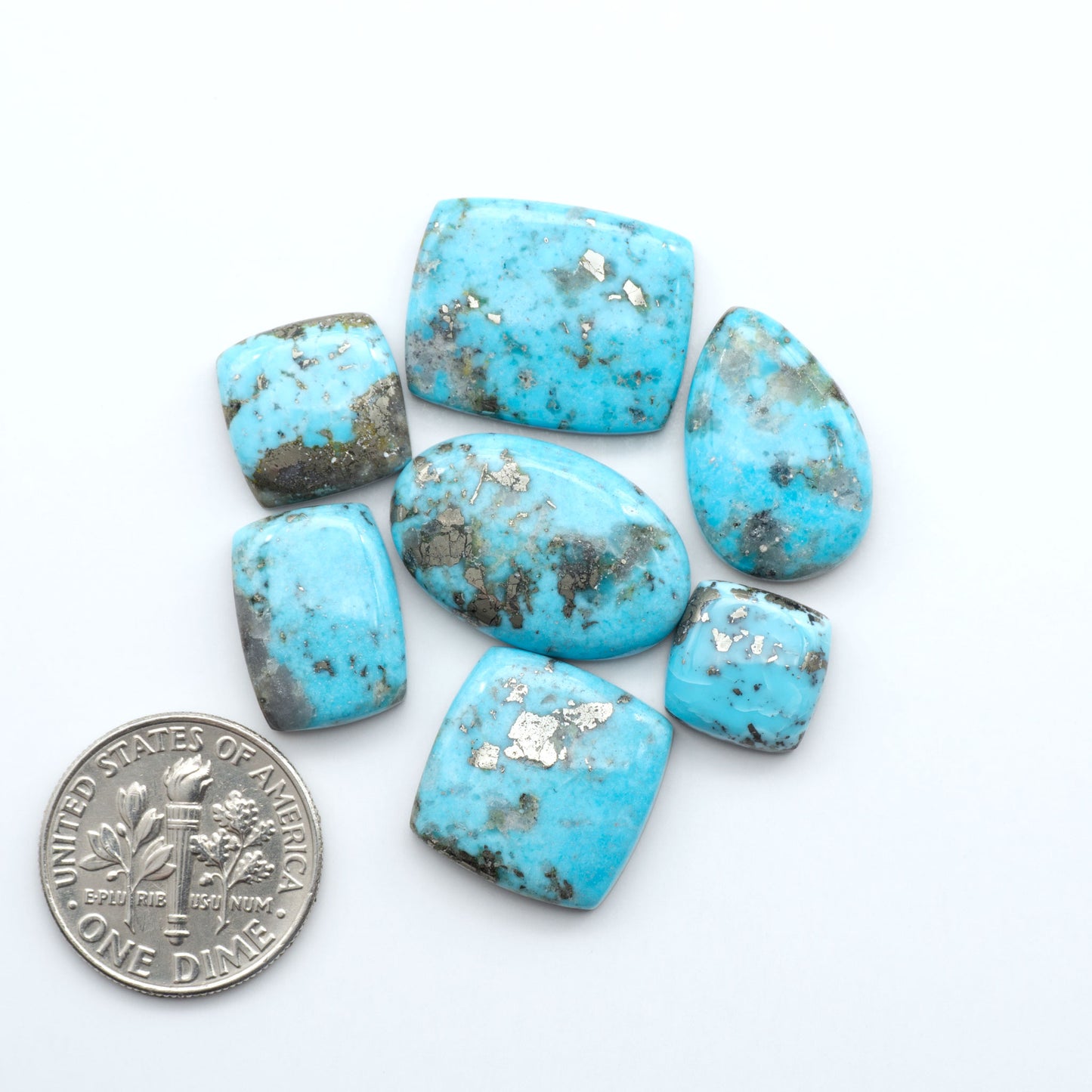 Nacozari turquoise cabochons are striking gemstones known for their vibrant blue to greenish-blue colors and pyrite, these stones are prized in jewelry making.