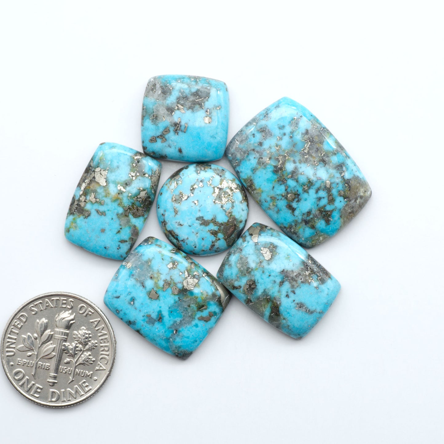 Nacozari turquoise cabochons are striking gemstones known for their vibrant blue to greenish-blue colors and pyrite, these stones are prized in jewelry making.