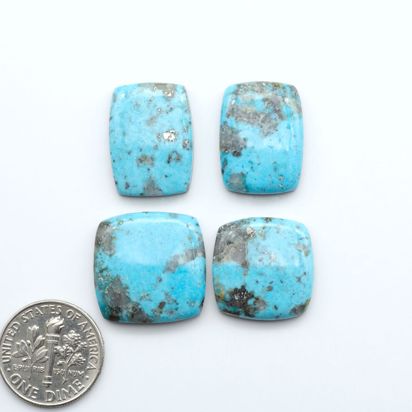 Nacozari turquoise cabochons are striking gemstones known for their vibrant blue to greenish-blue colors and pyrite, these stones are prized in jewelry making.