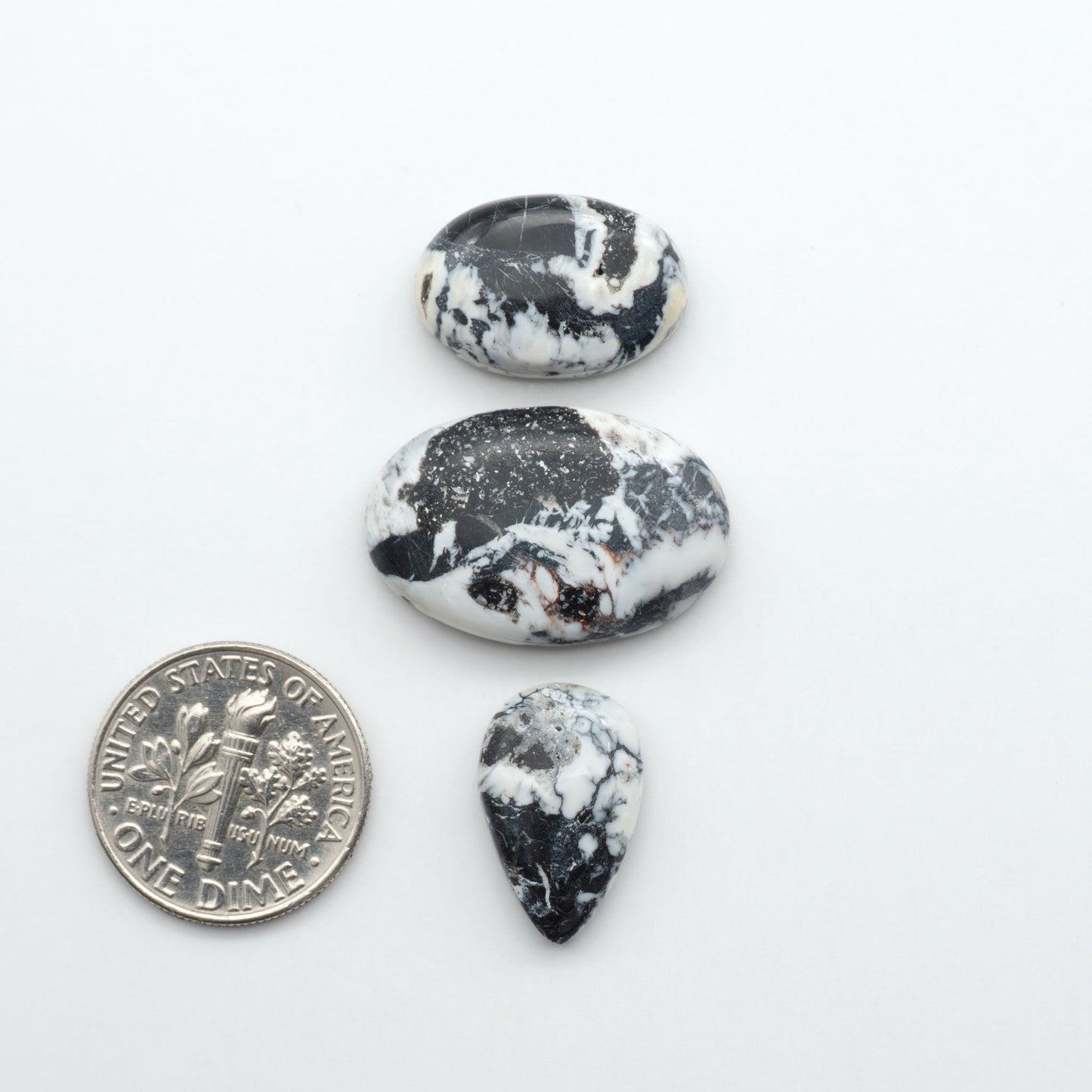 Natural White Buffalo Stone Cabochons are semi-precious gemstones cut into shapes ideal for jewelry-making, making them an excellent choice for artisans.