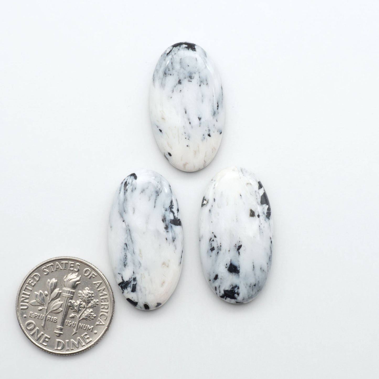 Natural White Buffalo Stone Cabochons are semi-precious gemstones cut into shapes ideal for jewelry-making, making them an excellent choice for artisans.