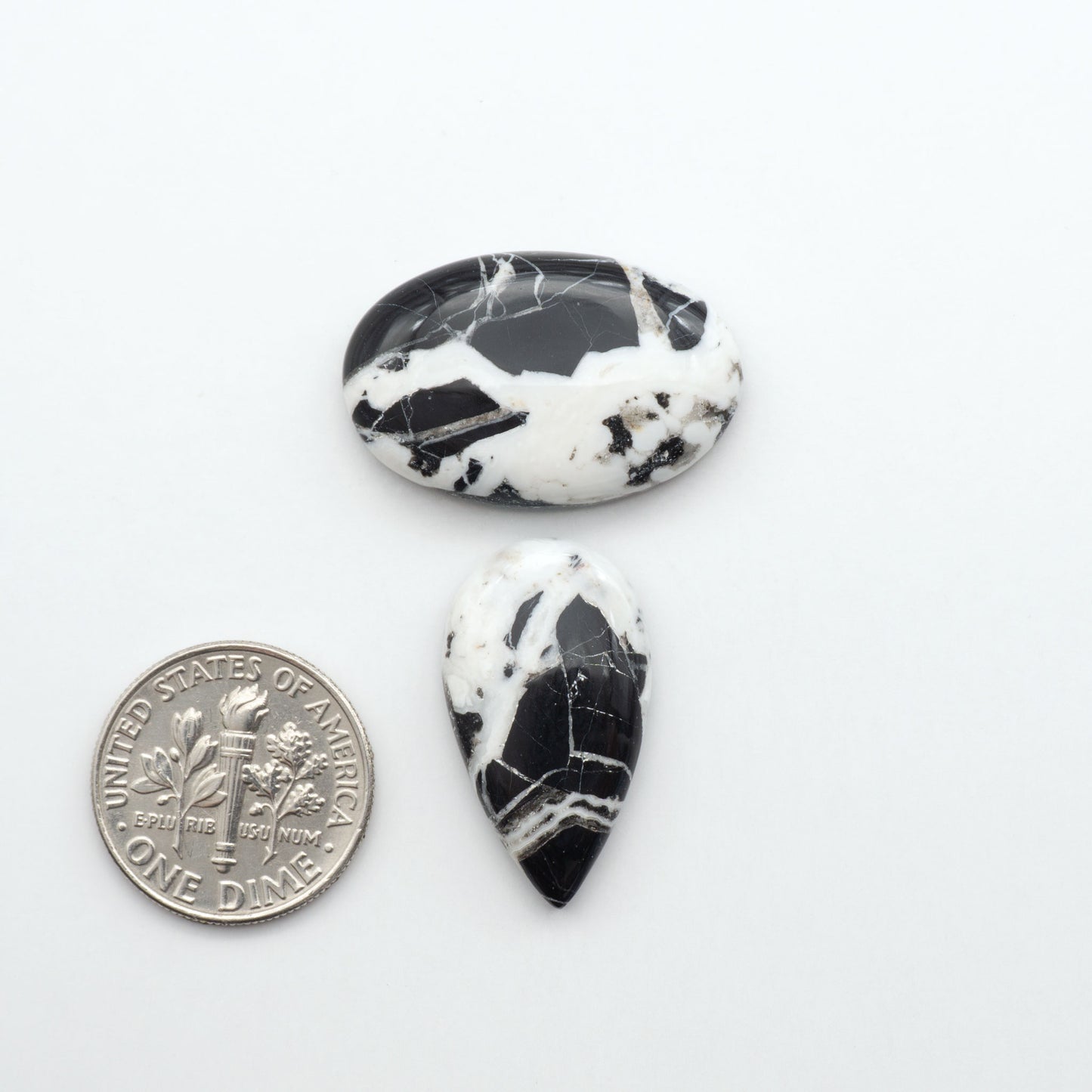 Natural White Buffalo Stone Cabochons are semi-precious gemstones cut into shapes ideal for jewelry-making, making them an excellent choice for artisans.