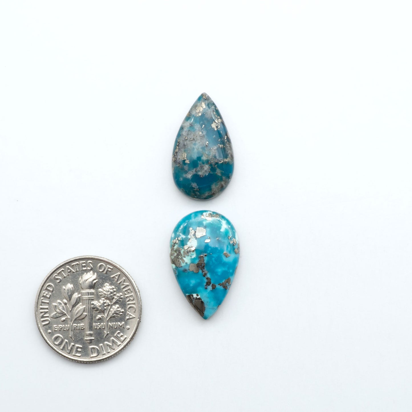 Nacozari turquoise cabochons are striking gemstones known for their vibrant blue to greenish-blue colors and pyrite, these stones are prized in jewelry making.