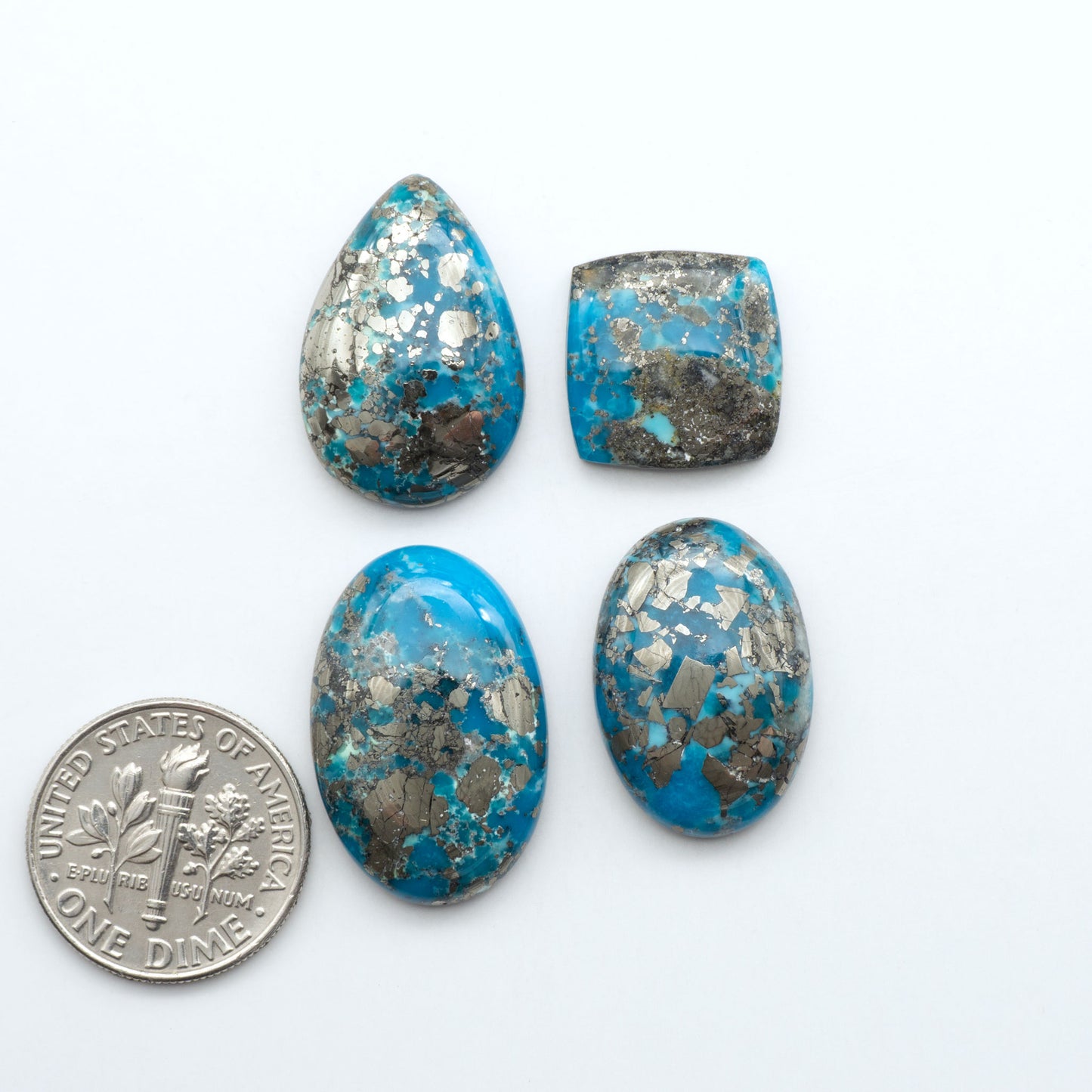 Nacozari turquoise cabochons are striking gemstones known for their vibrant blue to greenish-blue colors and pyrite, these stones are prized in jewelry making.
