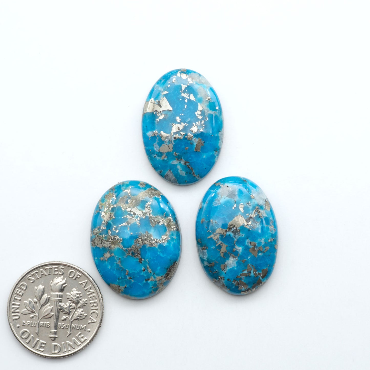 Nacozari turquoise cabochons are striking gemstones known for their vibrant blue to greenish-blue colors and pyrite, these stones are prized in jewelry making.