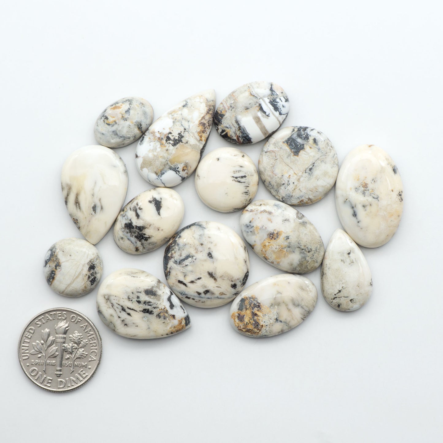 Natural White Buffalo Stone Cabochons are semi-precious gemstones cut into shapes ideal for jewelry-making, making them an excellent choice for artisans.