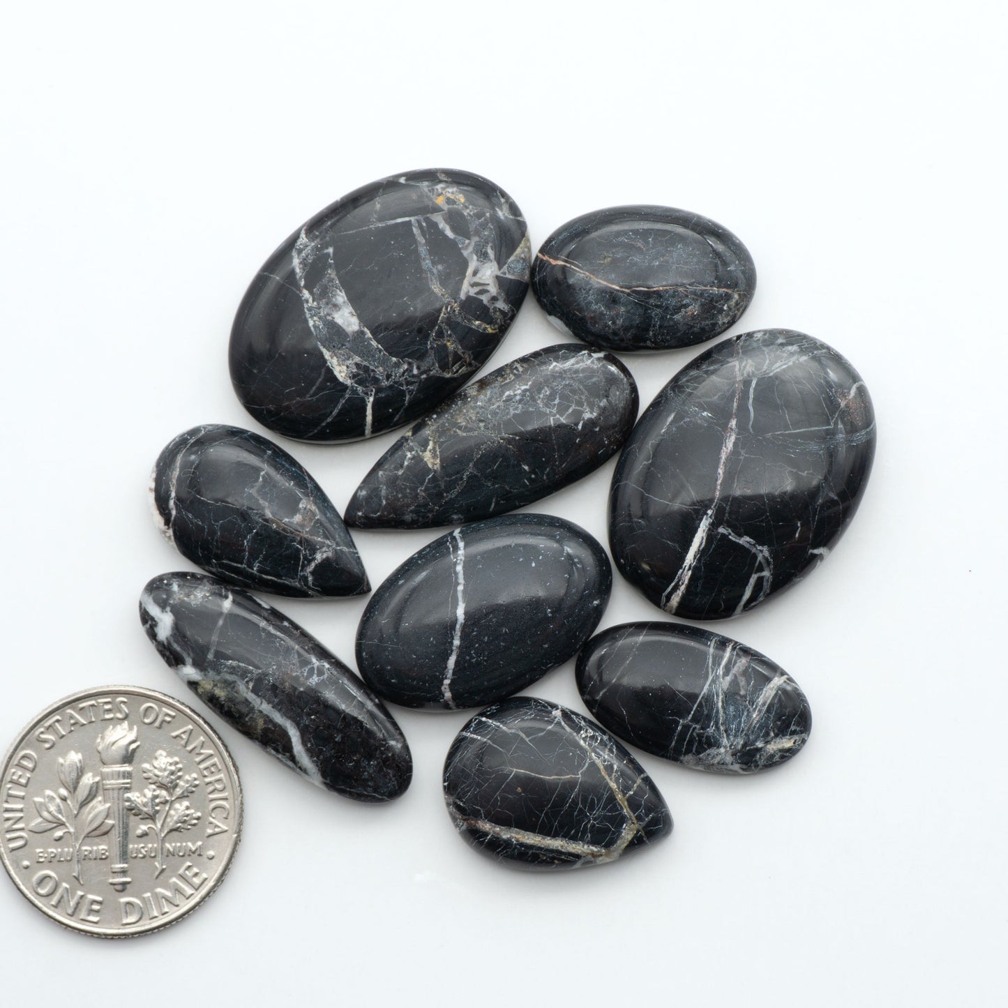 Natural White Buffalo Stone Cabochons are semi-precious gemstones cut into shapes ideal for jewelry-making, making them an excellent choice for artisans.