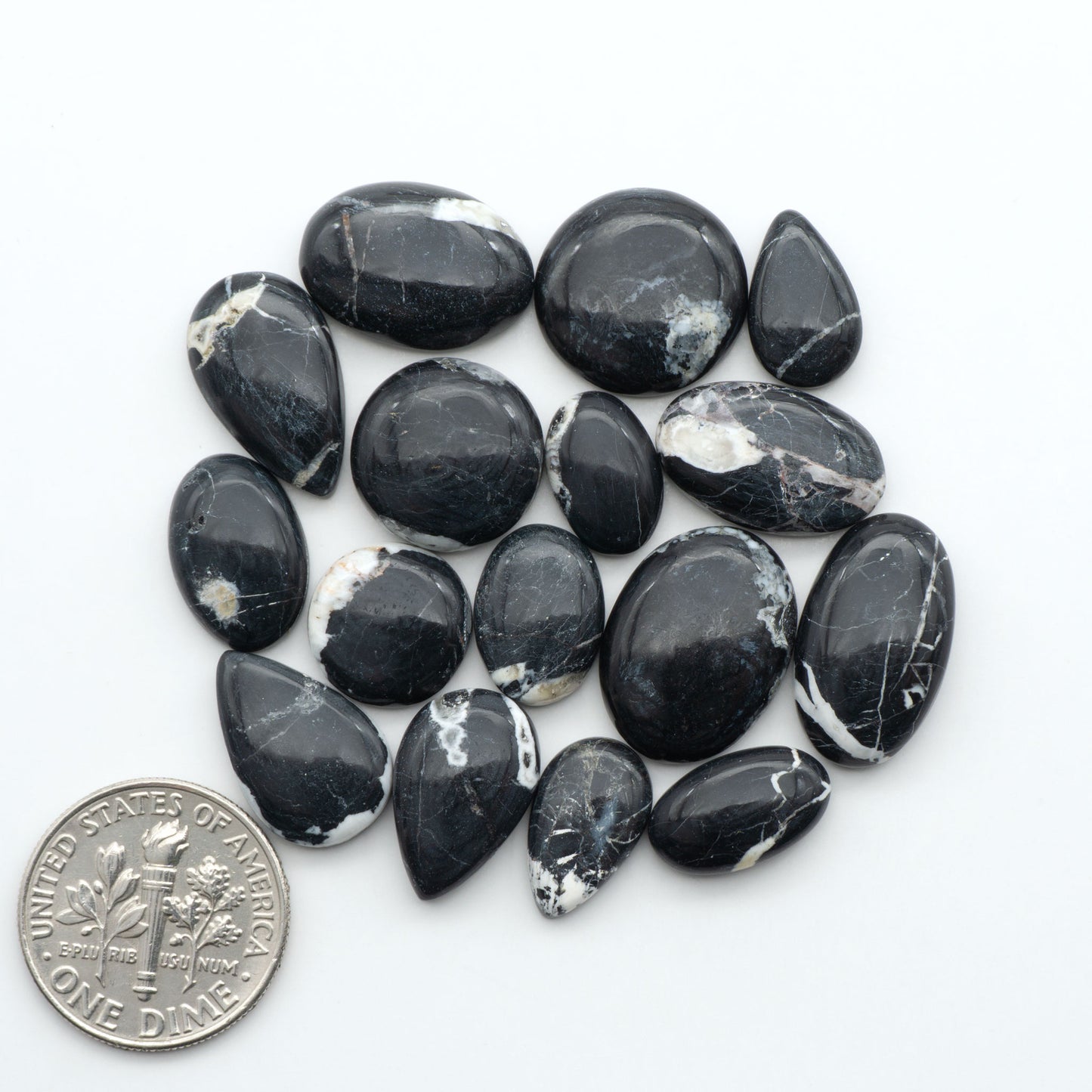 Natural White Buffalo Stone Cabochons are semi-precious gemstones cut into shapes ideal for jewelry-making, making them an excellent choice for artisans.
