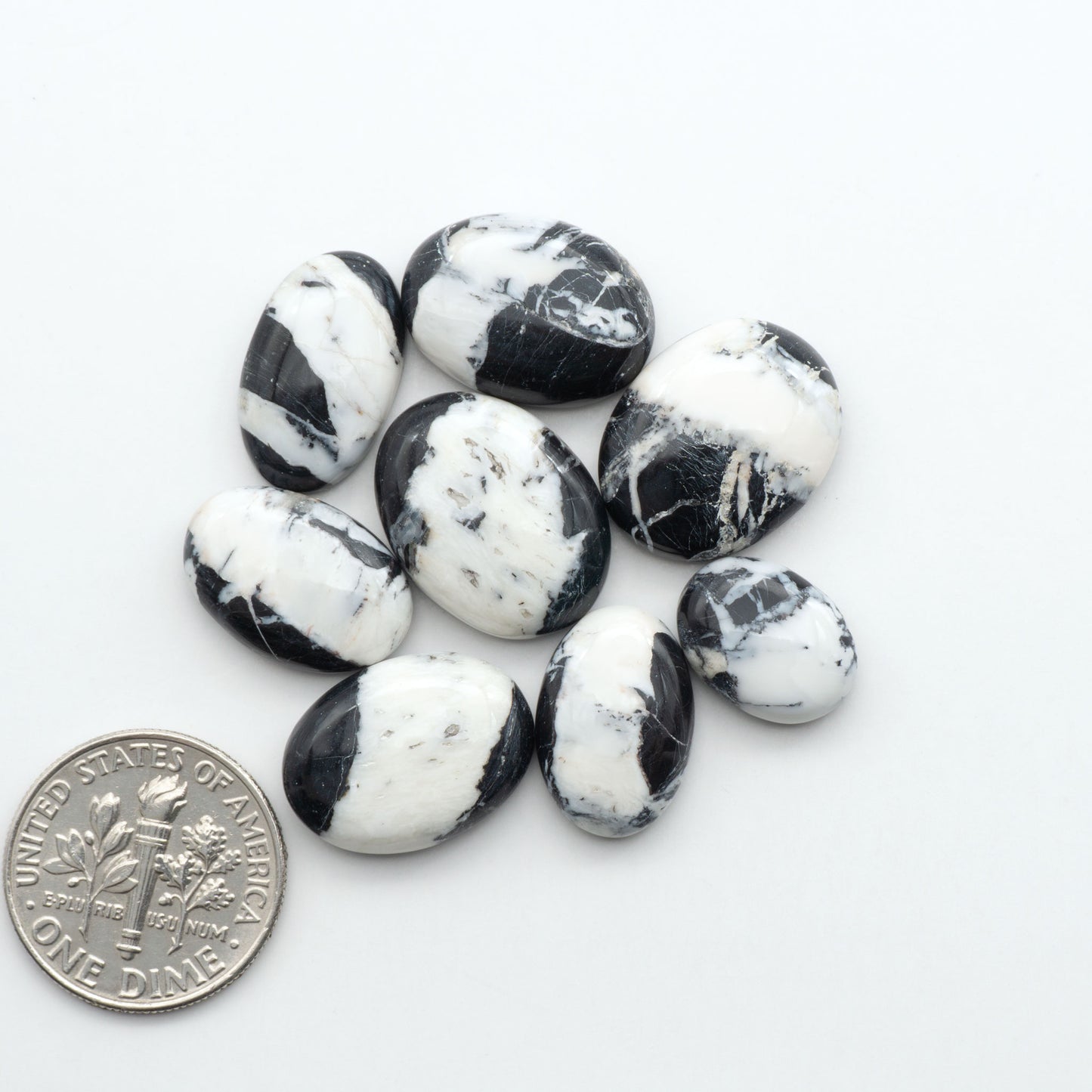 Natural White Buffalo Stone Cabochons are semi-precious gemstones cut into shapes ideal for jewelry-making, making them an excellent choice for artisans.