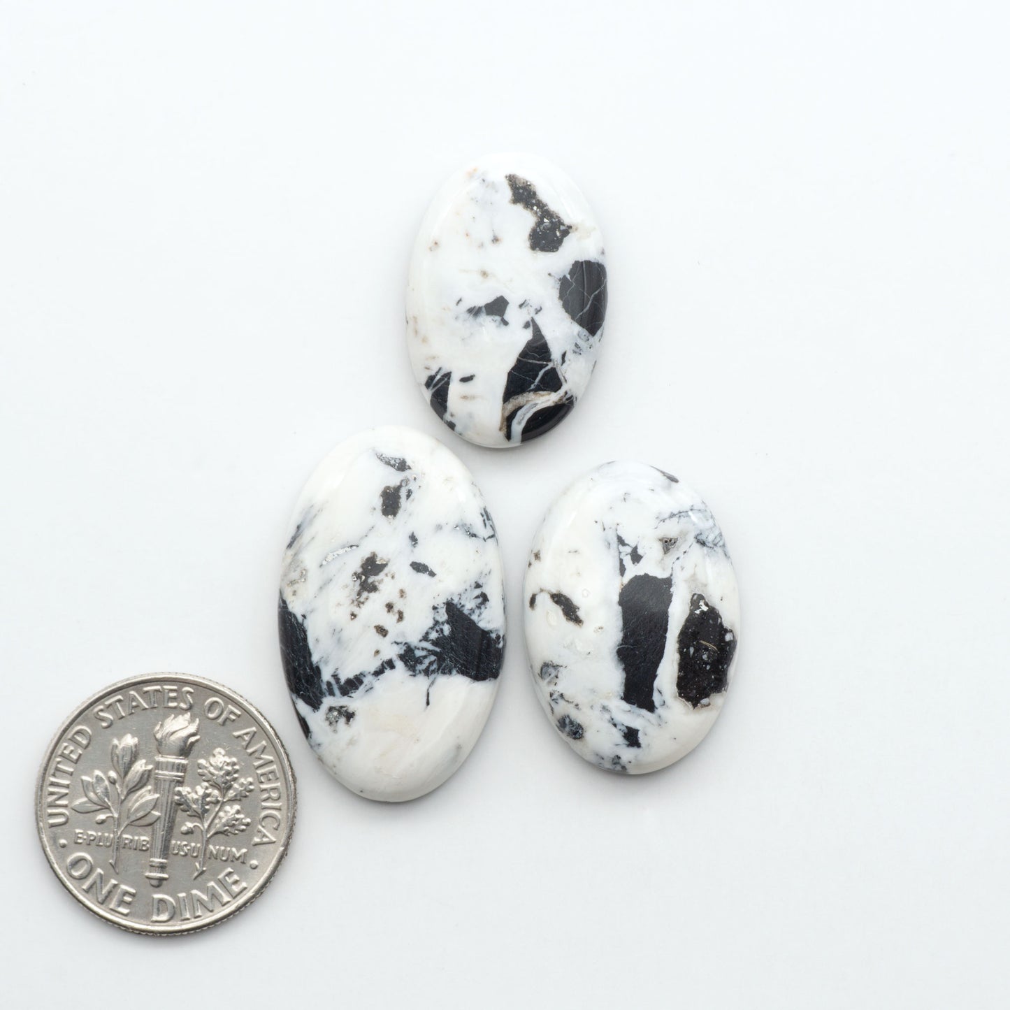 Natural White Buffalo Stone Cabochons are semi-precious gemstones cut into shapes ideal for jewelry-making, making them an excellent choice for artisans.