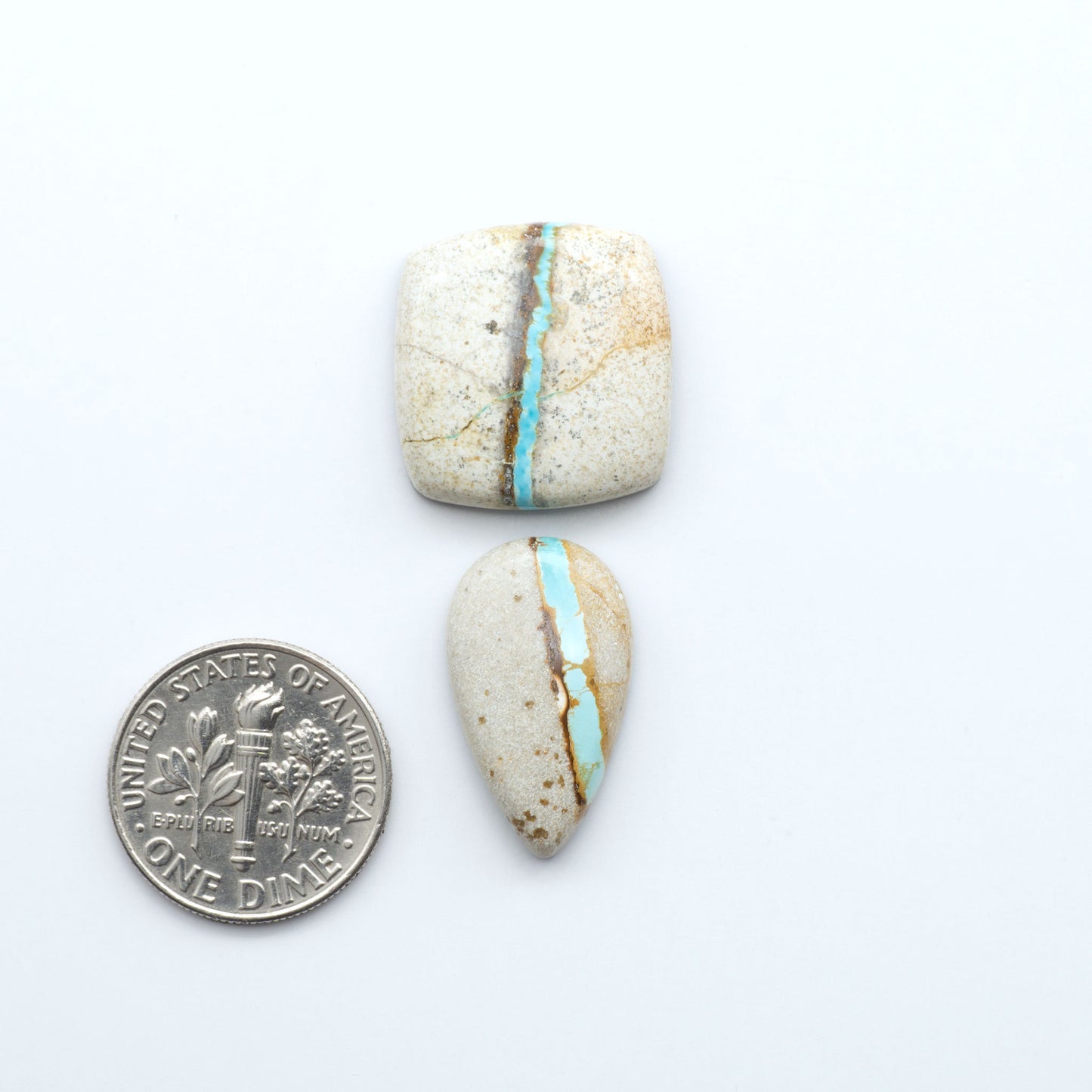 Royston Turquoise cabochons are famous for their distinctive matrix and unique green and blue hues, making them a favored option among jewelry designers.