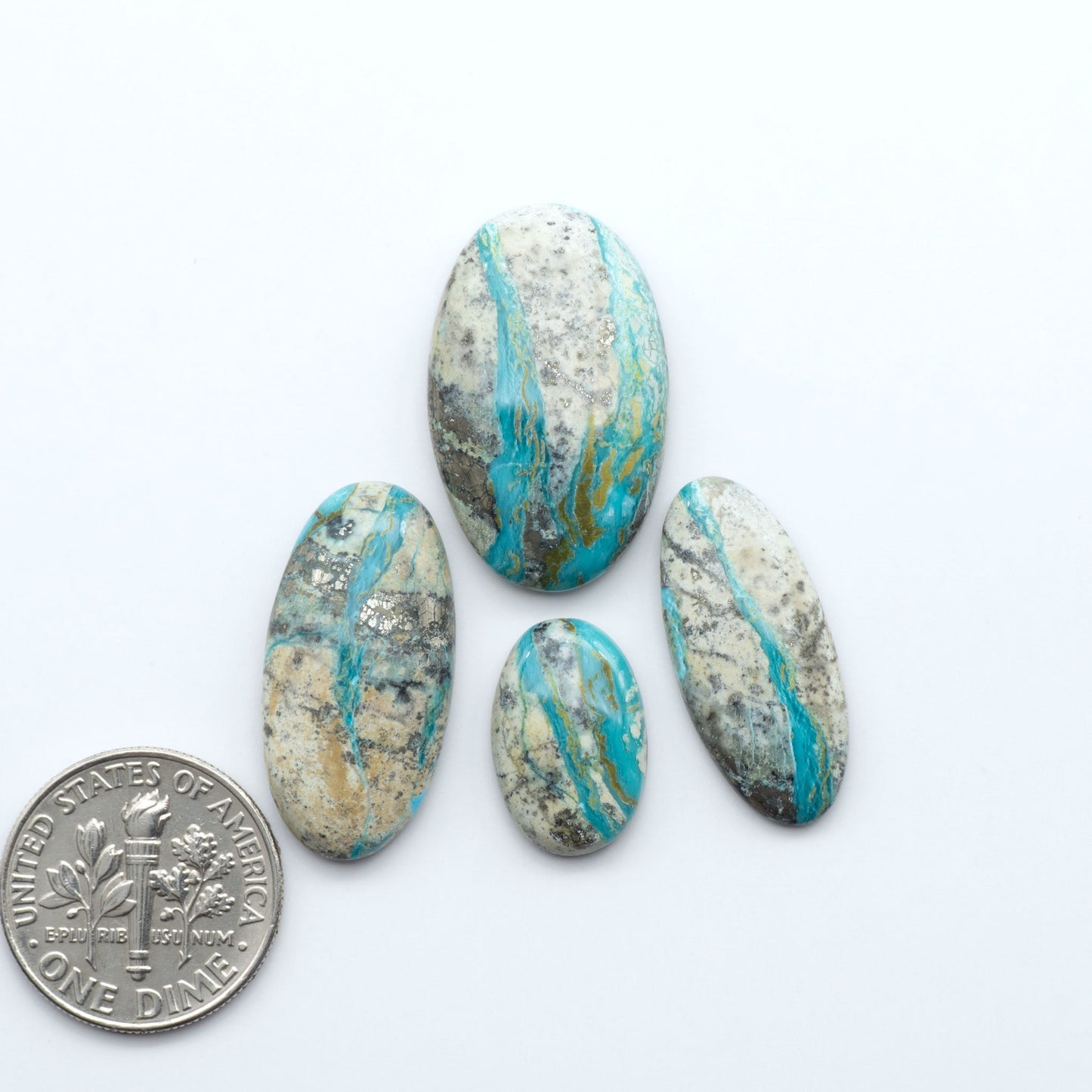 Royston Turquoise cabochons are famous for their distinctive matrix and unique green and blue hues, making them a favored option among jewelry designers.