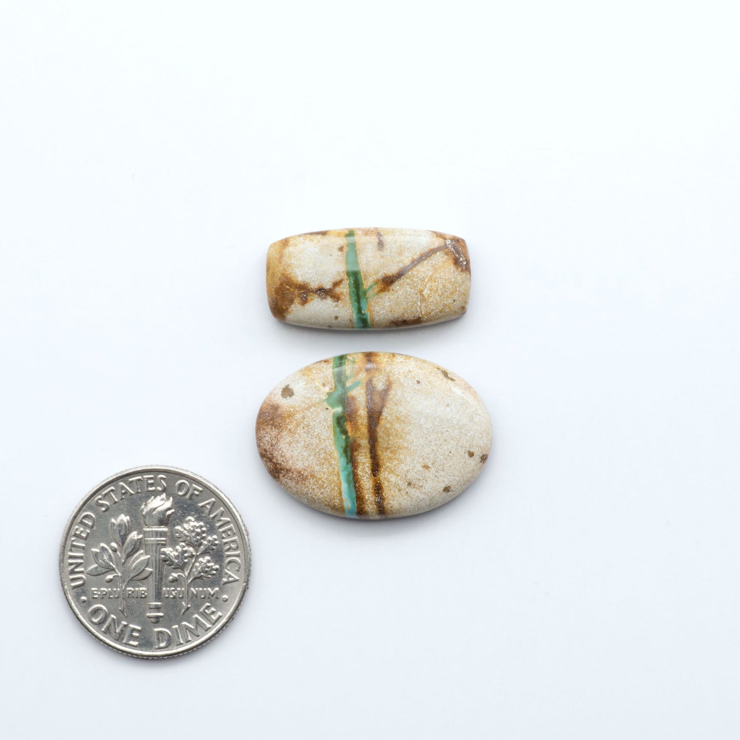 Royston Turquoise cabochons are famous for their distinctive matrix and unique green and blue hues, making them a favored option among jewelry designers.