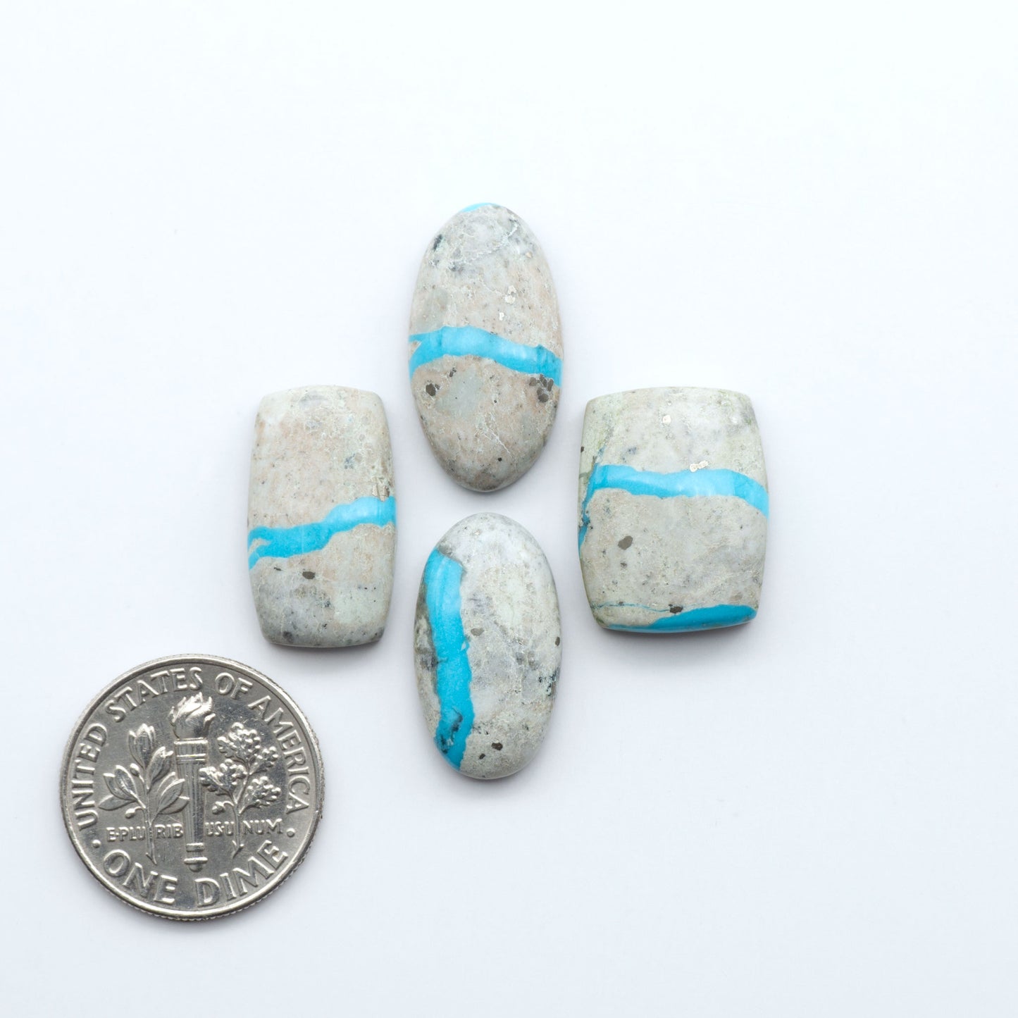 Royston Turquoise cabochons are famous for their distinctive matrix and unique green and blue hues, making them a favored option among jewelry designers.