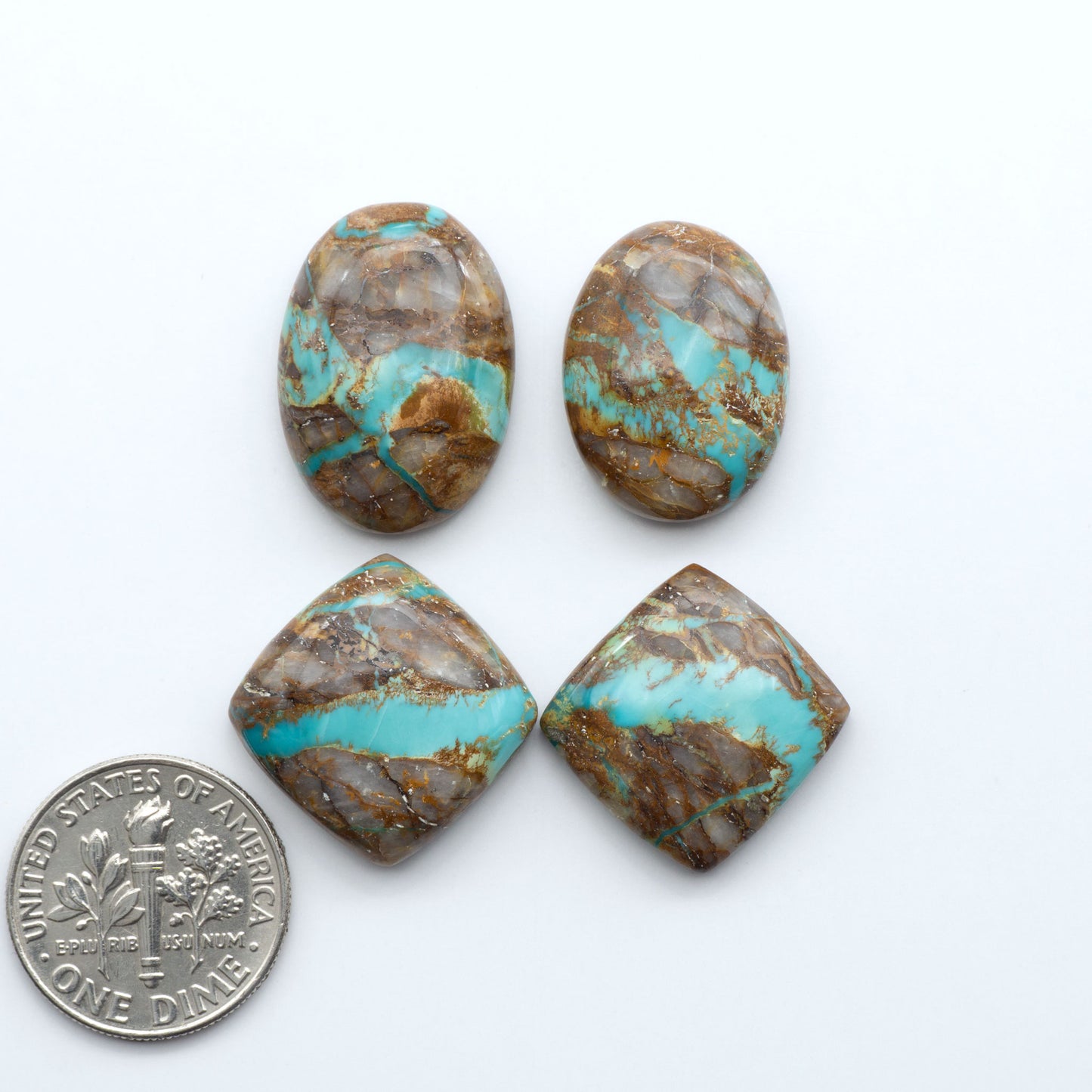 Royston Turquoise cabochons are famous for their distinctive matrix and unique green and blue hues, making them a favored option among jewelry designers.