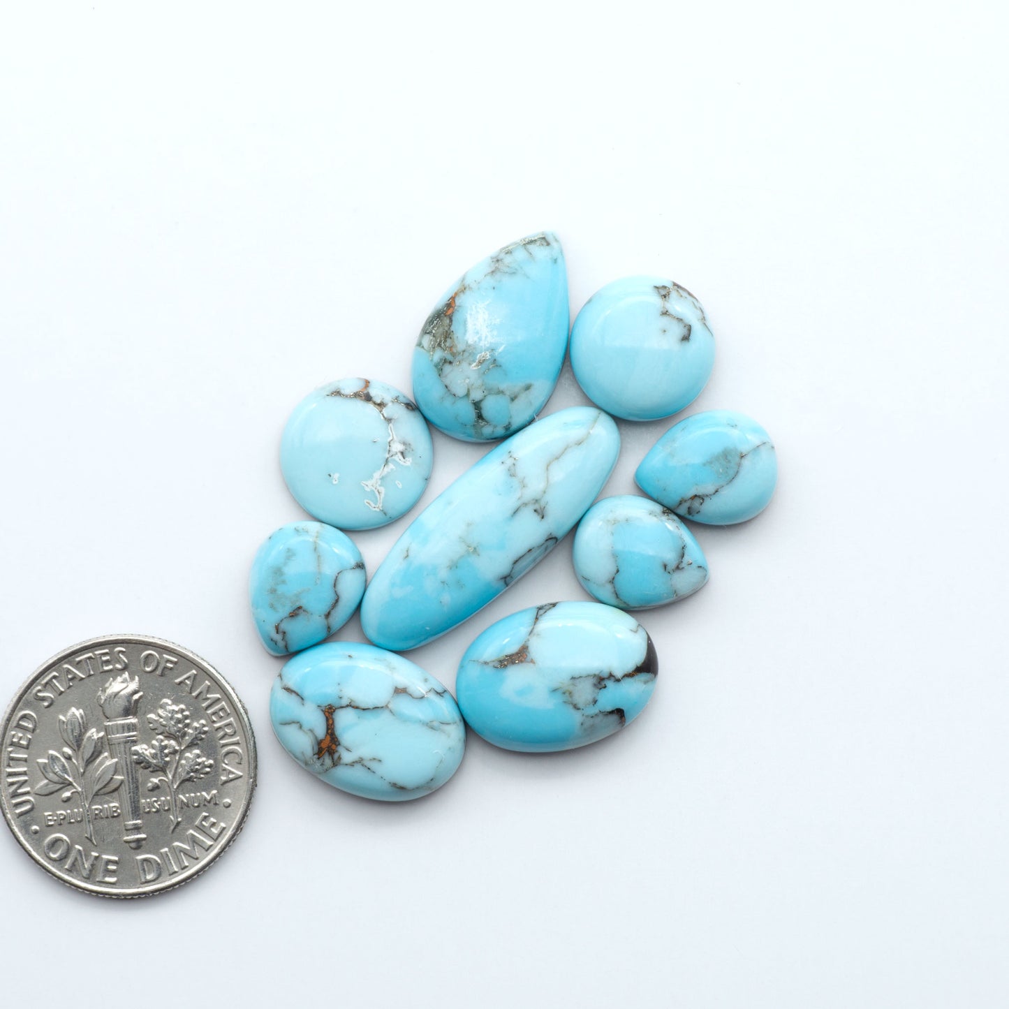 Enhance your jewelry designs with Pressed Turquoise Nugget Cabochons. Crafted from composite materials they add a captivating touch to your creations.