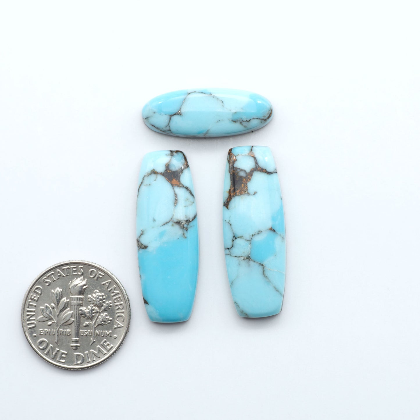 Enhance your jewelry designs with Pressed Turquoise Nugget Cabochons. Crafted from composite materials they add a captivating touch to your creations.