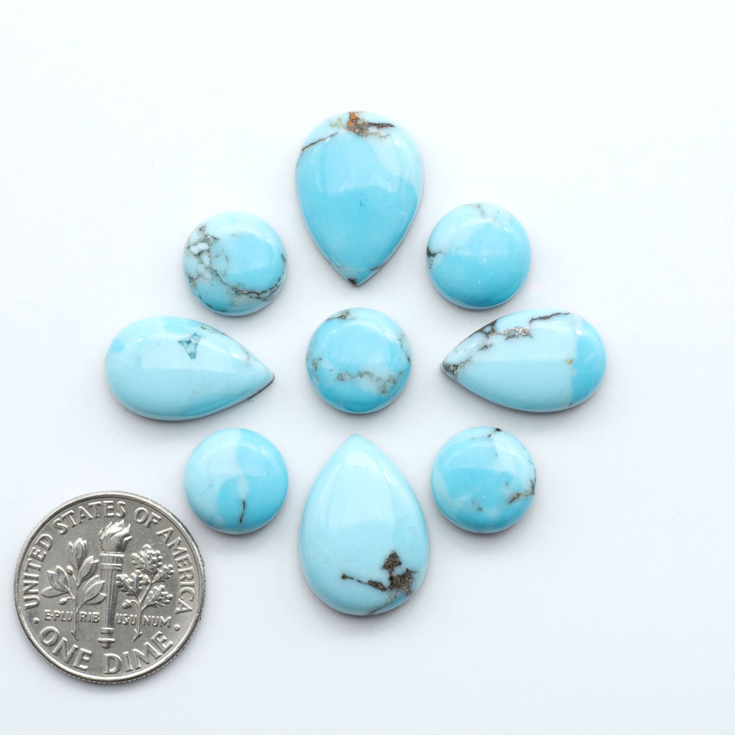Enhance your jewelry designs with Pressed Turquoise Nugget Cabochons. Crafted from composite materials they add a captivating touch to your creations.