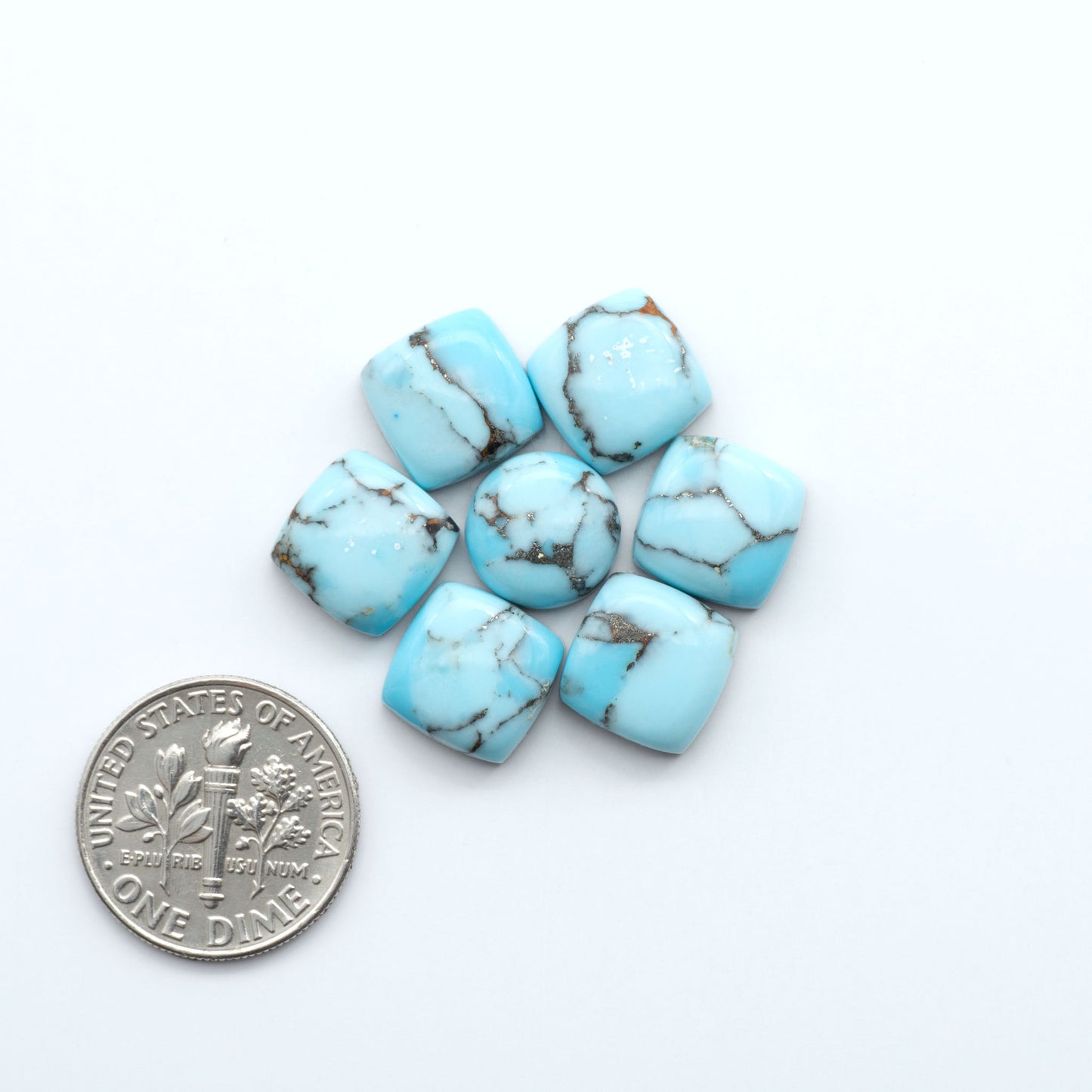 Enhance your jewelry designs with Pressed Turquoise Nugget Cabochons. Crafted from composite materials they add a captivating touch to your creations.