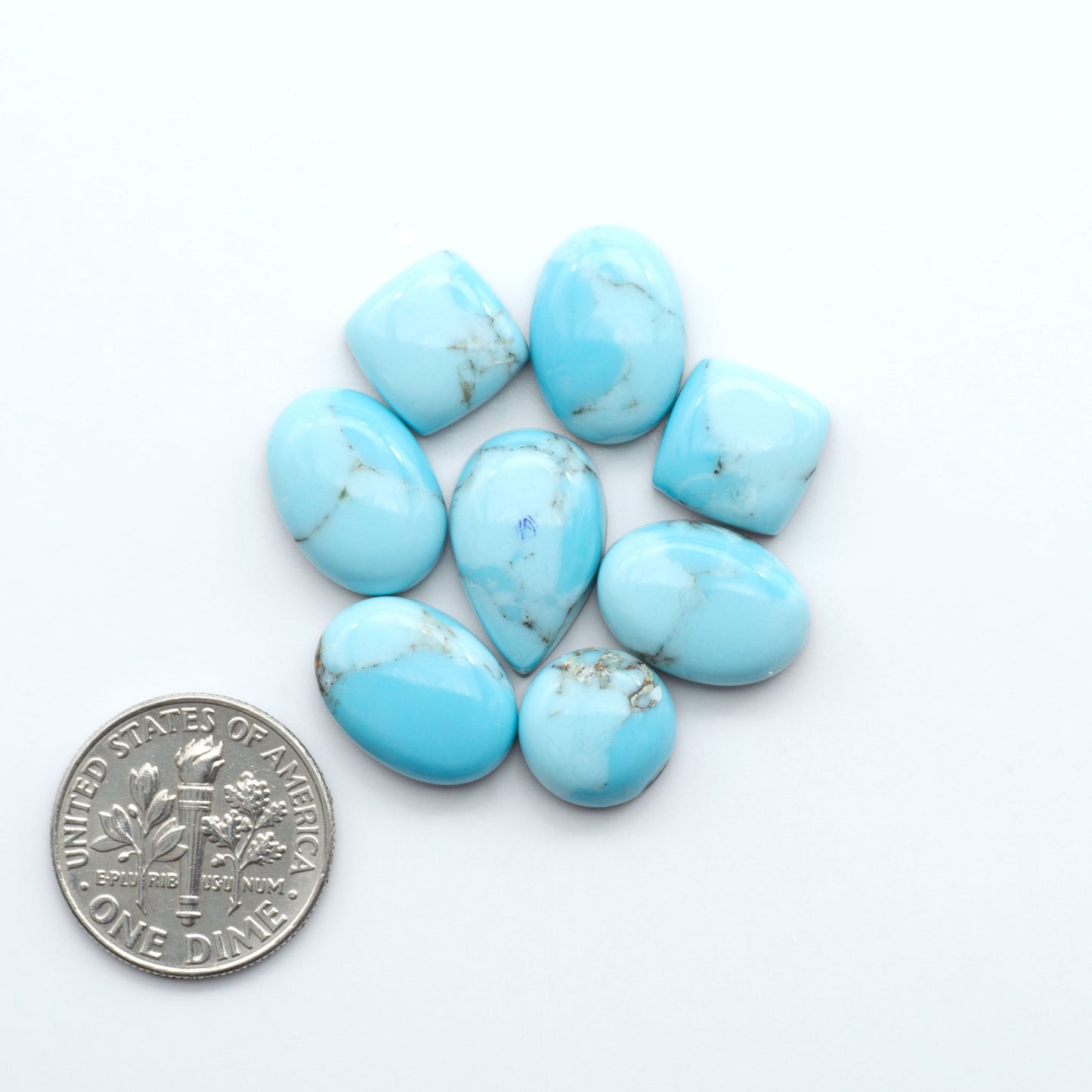 Enhance your jewelry designs with Pressed Turquoise Nugget Cabochons. Crafted from composite materials they add a captivating touch to your creations.