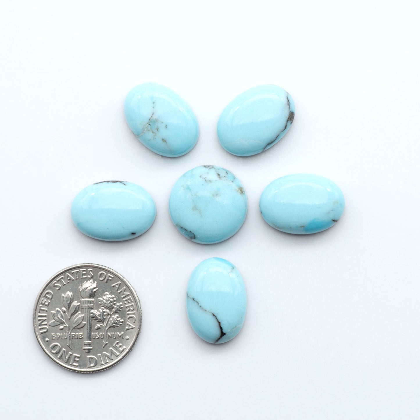 Enhance your jewelry designs with Pressed Turquoise Nugget Cabochons. Crafted from composite materials they add a captivating touch to your creations.