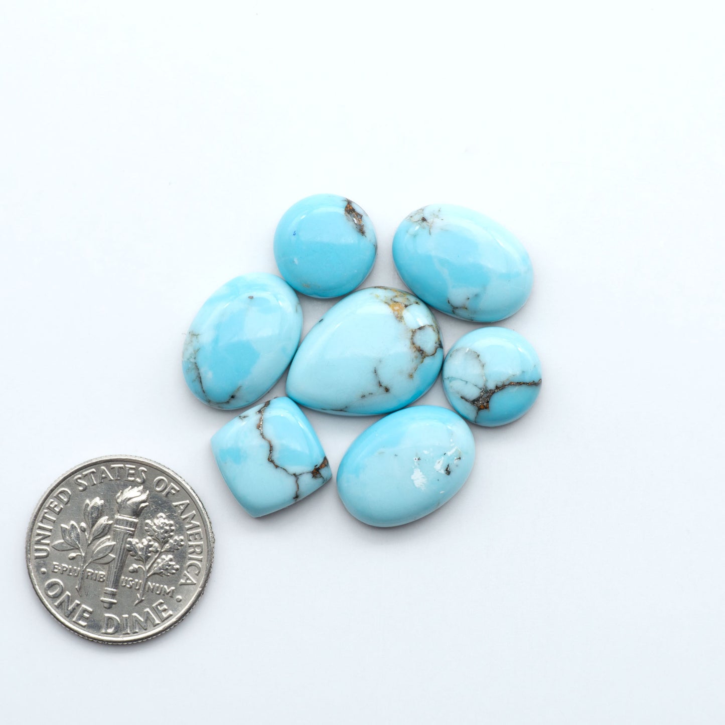 Enhance your jewelry designs with Pressed Turquoise Nugget Cabochons. Crafted from composite materials they add a captivating touch to your creations.