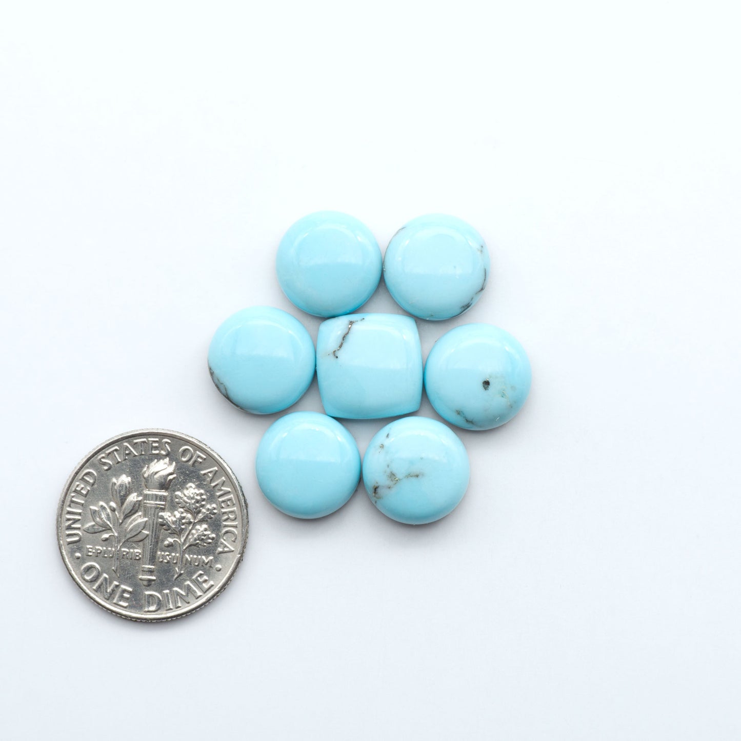 Enhance your jewelry designs with Pressed Turquoise Nugget Cabochons. Crafted from composite materials they add a captivating touch to your creations.