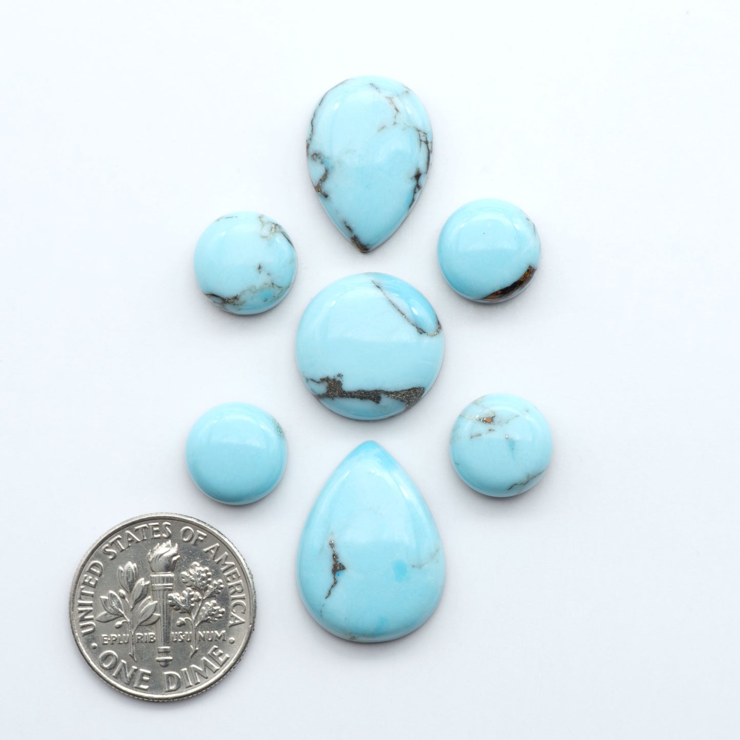 Enhance your jewelry designs with Pressed Turquoise Nugget Cabochons. Crafted from composite materials they add a captivating touch to your creations.