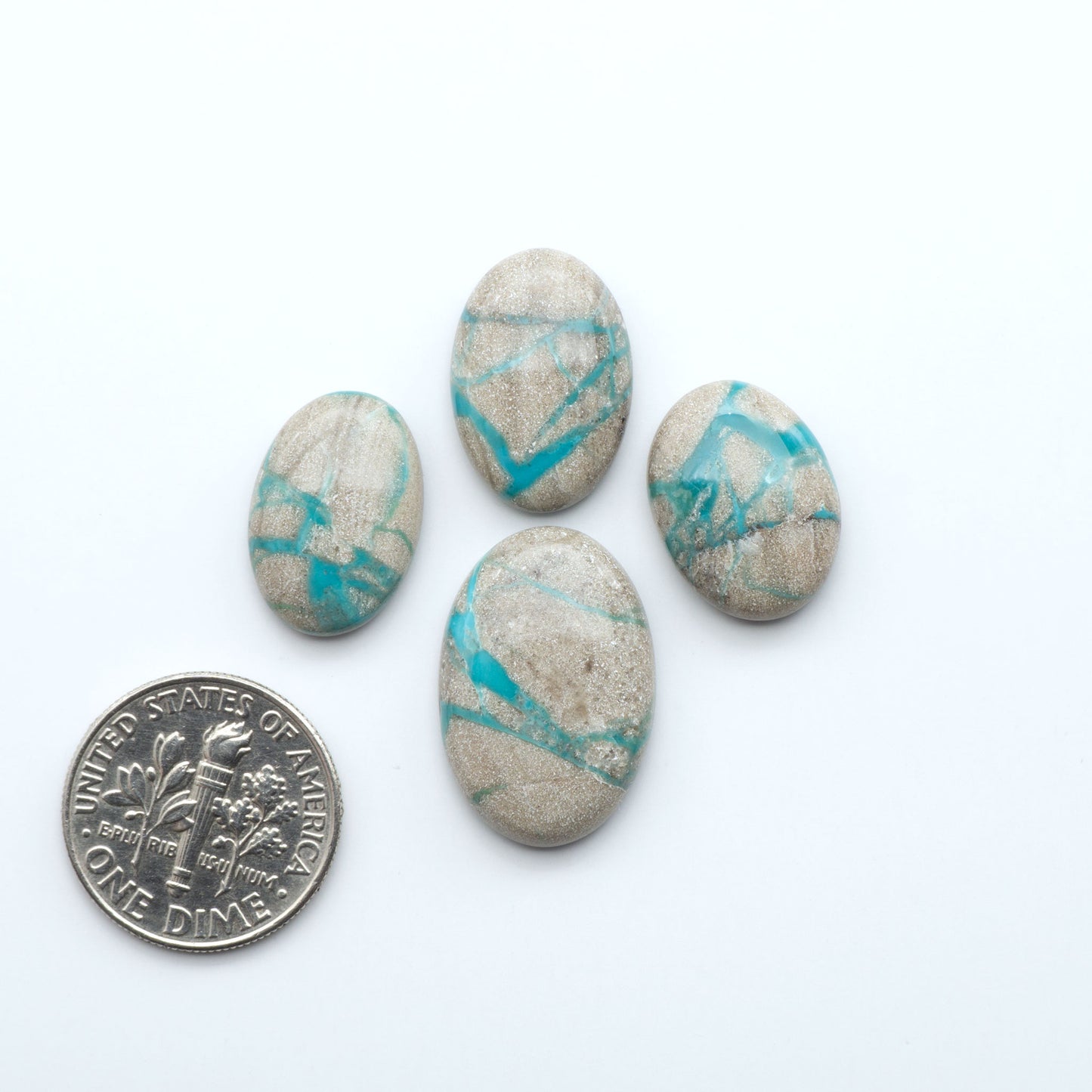 Carico Lake Turquoise cabochons with vibrant aqua-blue to turquoise tones and natural matrix, ideal for rings, pendants, and artisan jewelry.