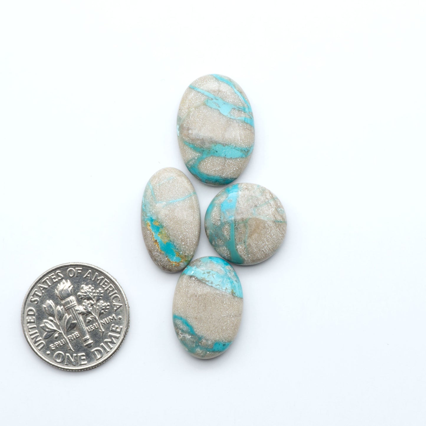 Carico Lake Turquoise cabochons with vibrant aqua-blue to turquoise tones and natural matrix, ideal for rings, pendants, and artisan jewelry.