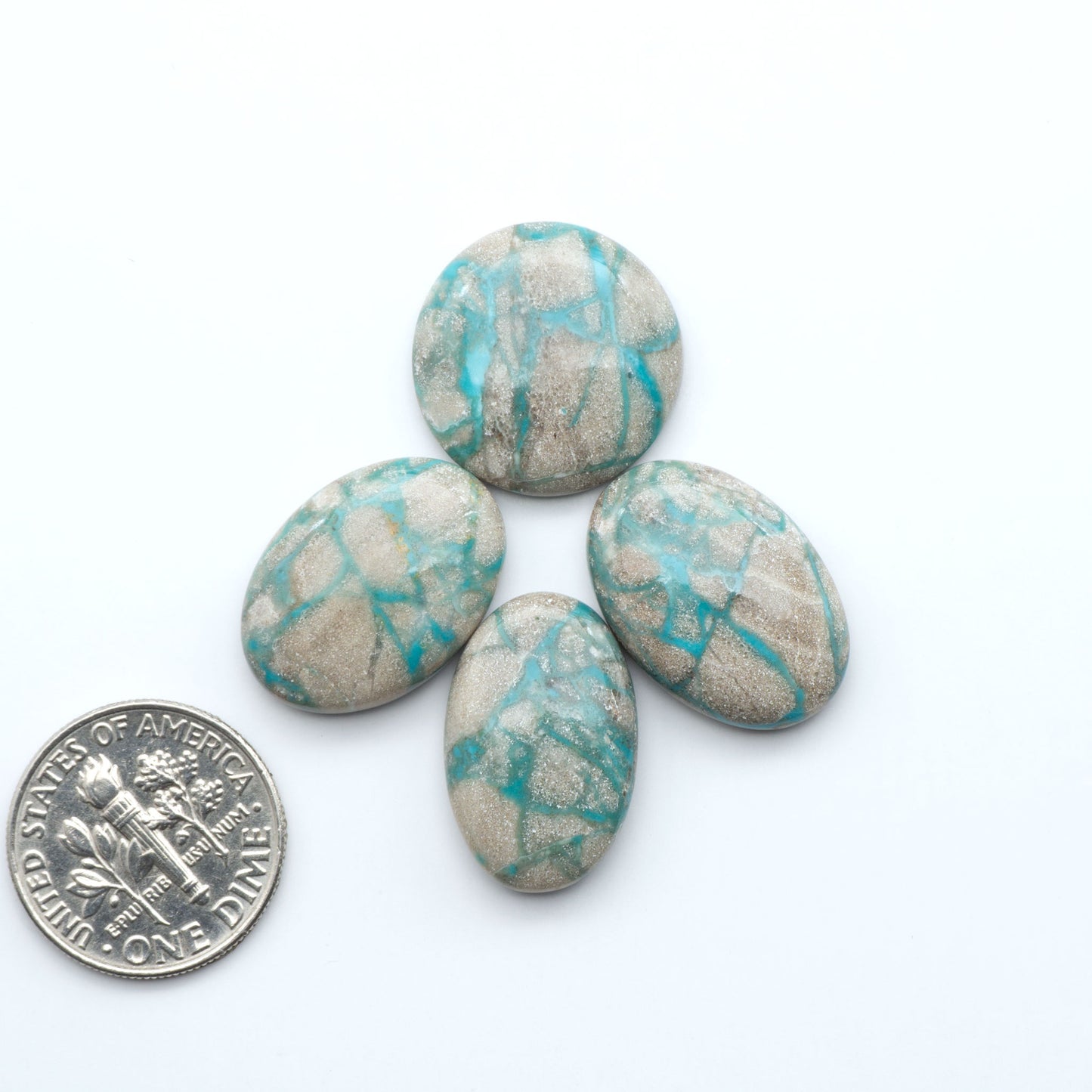 Carico Lake Turquoise cabochons with vibrant aqua-blue to turquoise tones and natural matrix, ideal for rings, pendants, and artisan jewelry.