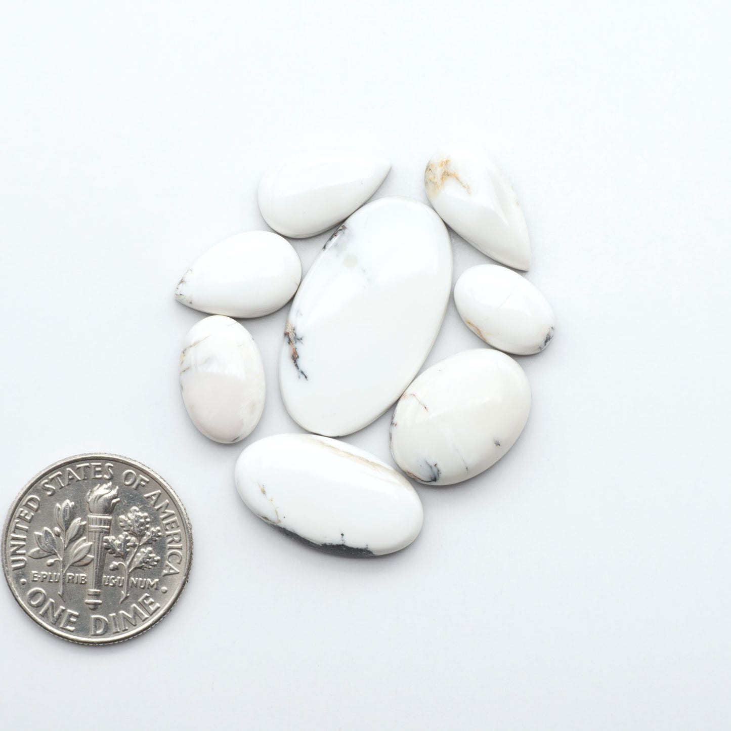 Natural White Buffalo Stone Cabochons are semi-precious gemstones cut into shapes ideal for jewelry-making, making them an excellent choice for artisans.