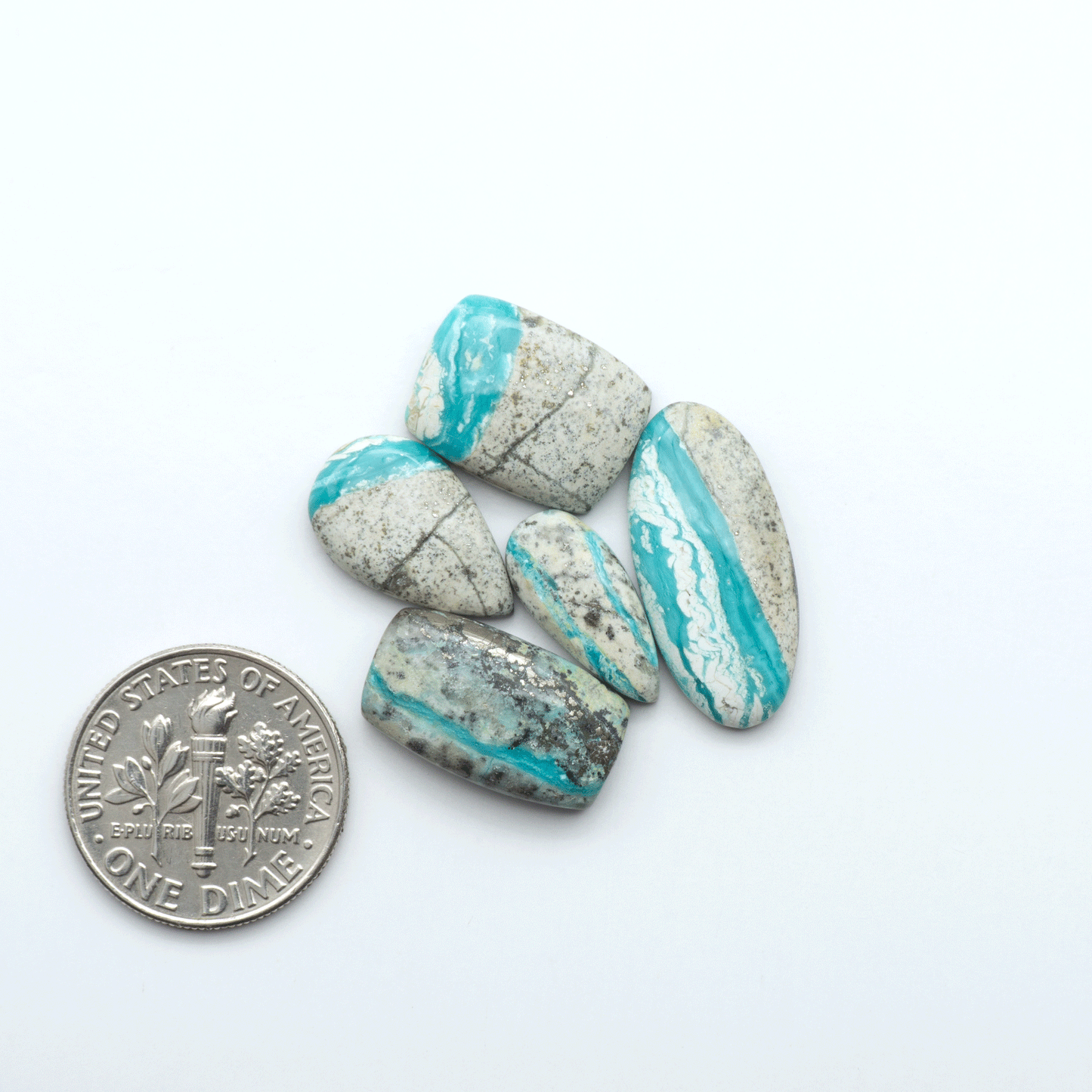 Royston Turquoise cabochons are famous for their distinctive matrix and unique green and blue hues, making them a favored option among jewelry designers.