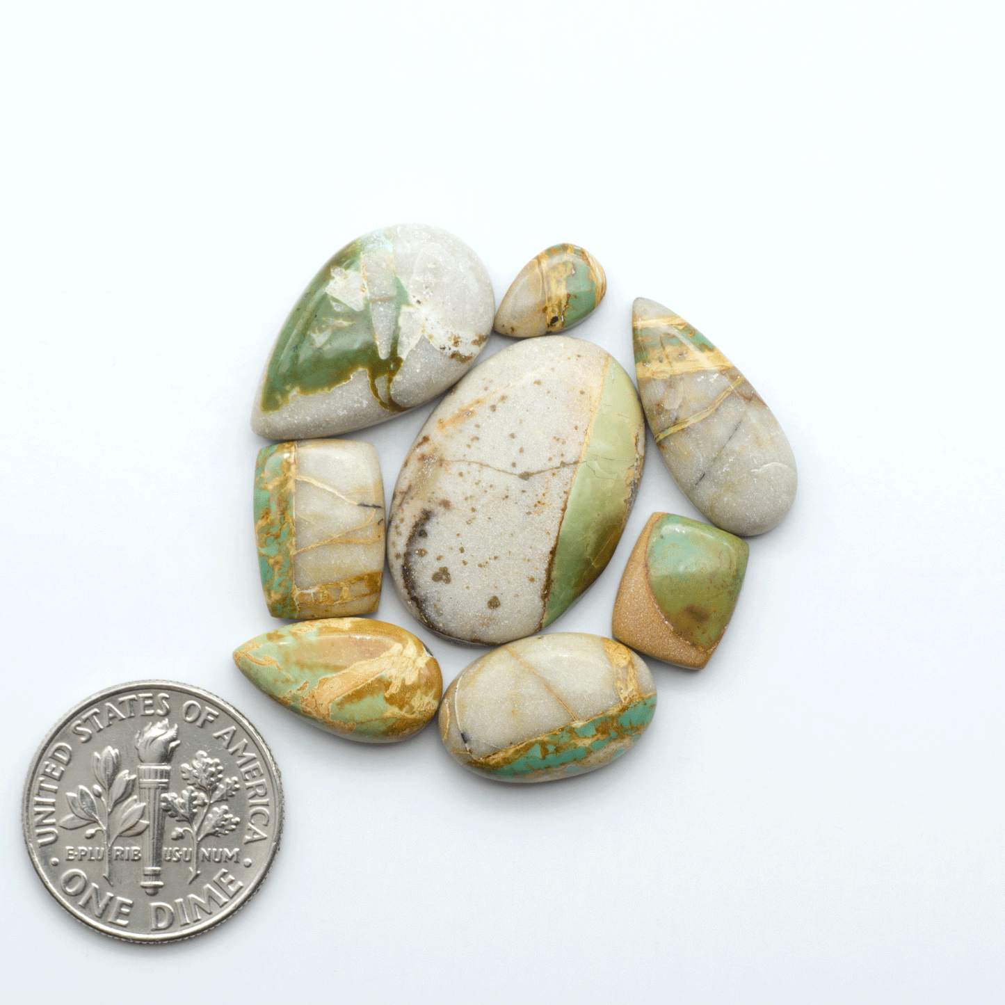 Royston Turquoise cabochons are famous for their distinctive matrix and unique green and blue hues, making them a favored option among jewelry designers.