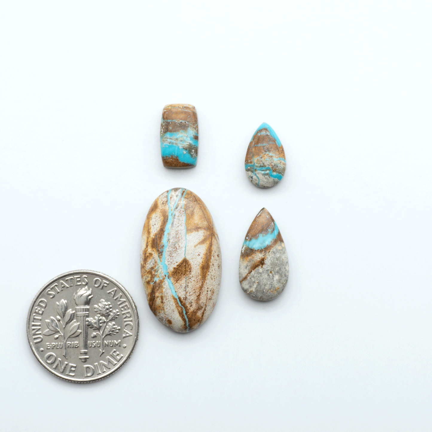 Royston Turquoise cabochons are famous for their distinctive matrix and unique green and blue hues, making them a favored option among jewelry designers.