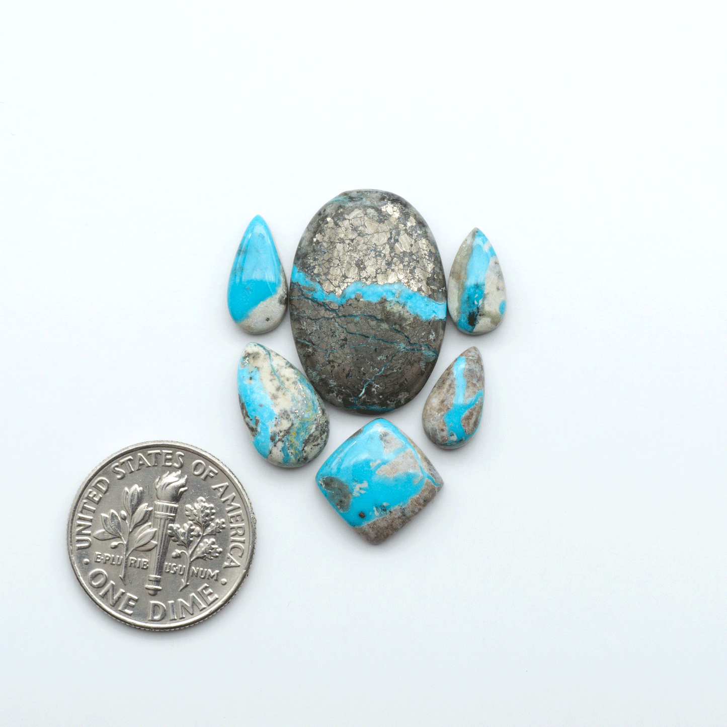 Royston Turquoise cabochons are famous for their distinctive matrix and unique green and blue hues, making them a favored option among jewelry designers.