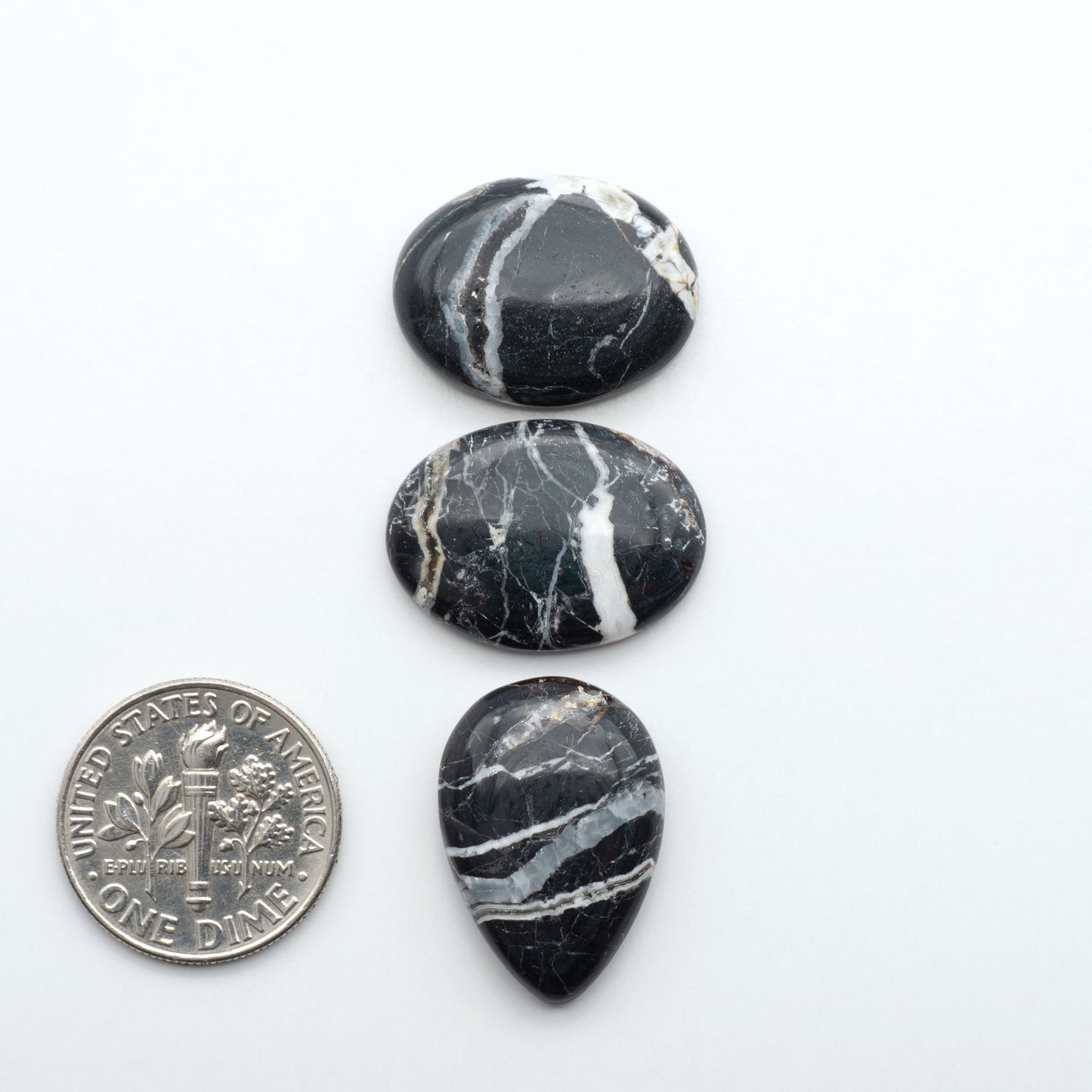 Natural White Buffalo Stone Cabochons are semi-precious gemstones cut into shapes ideal for jewelry-making, making them an excellent choice for artisans.