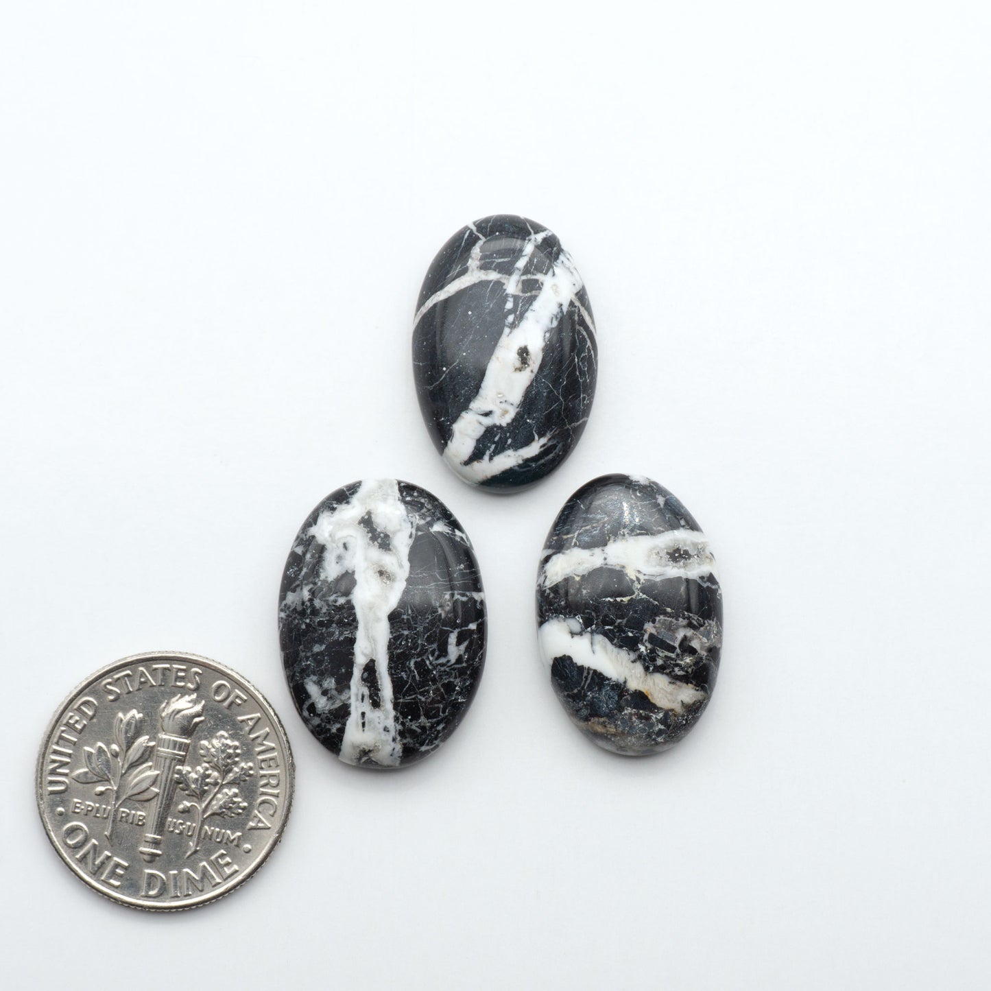Natural White Buffalo Stone Cabochons are semi-precious gemstones cut into shapes ideal for jewelry-making, making them an excellent choice for artisans.