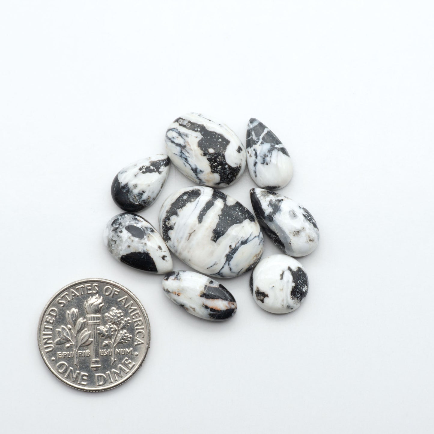 Natural White Buffalo Stone Cabochons are semi-precious gemstones cut into shapes ideal for jewelry-making, making them an excellent choice for artisans.