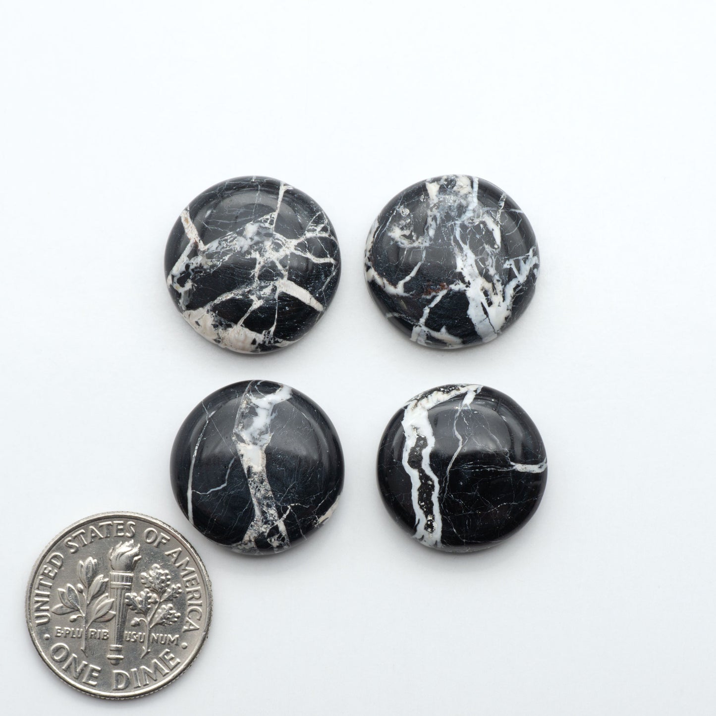 Natural White Buffalo Stone Cabochons are semi-precious gemstones cut into shapes ideal for jewelry-making, making them an excellent choice for artisans.