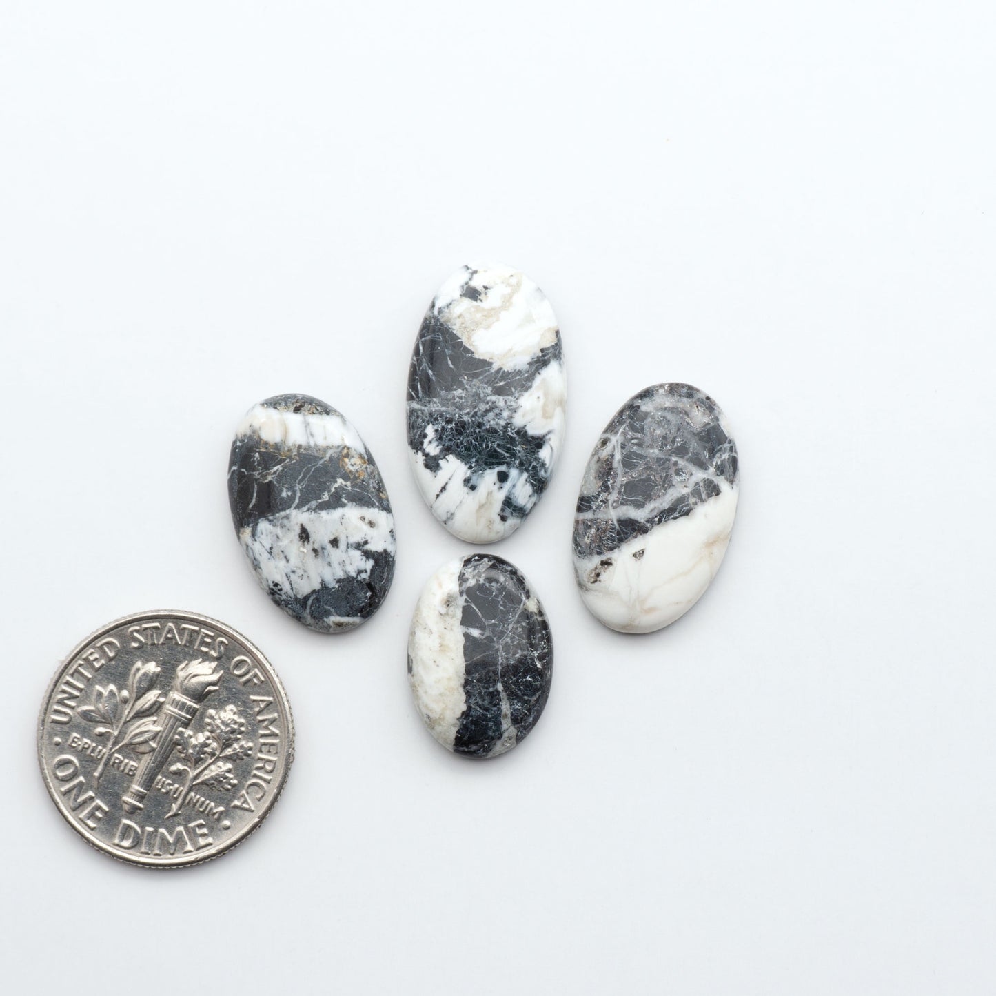 Natural White Buffalo Stone Cabochons are semi-precious gemstones cut into shapes ideal for jewelry-making, making them an excellent choice for artisans.