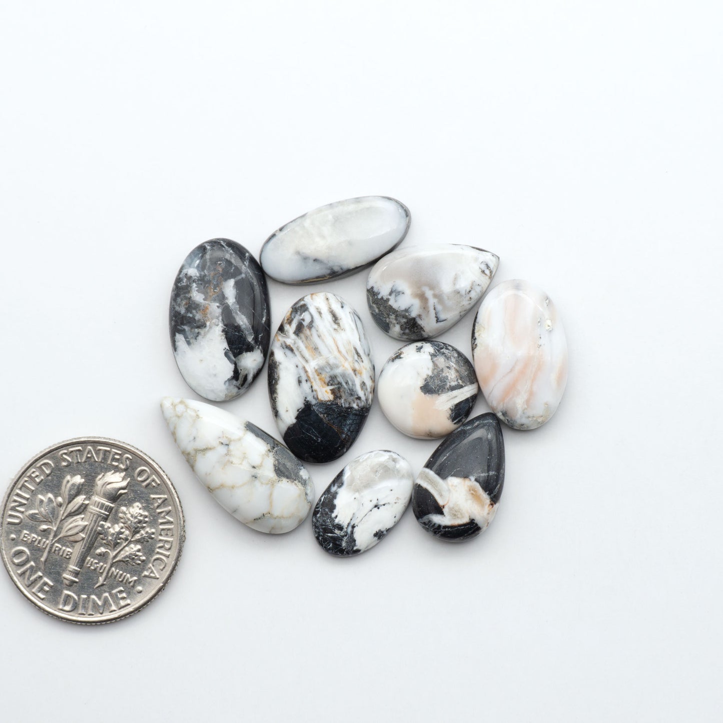 Natural White Buffalo Stone Cabochons are semi-precious gemstones cut into shapes ideal for jewelry-making, making them an excellent choice for artisans.