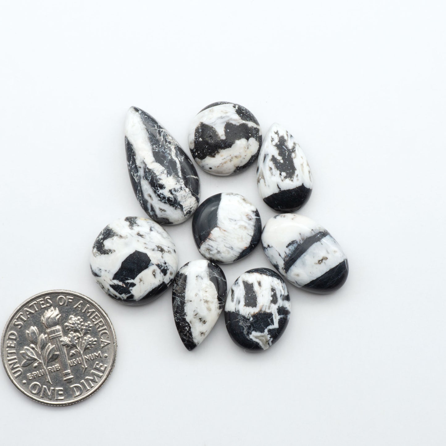 Natural White Buffalo Stone Cabochons are semi-precious gemstones cut into shapes ideal for jewelry-making, making them an excellent choice for artisans.
